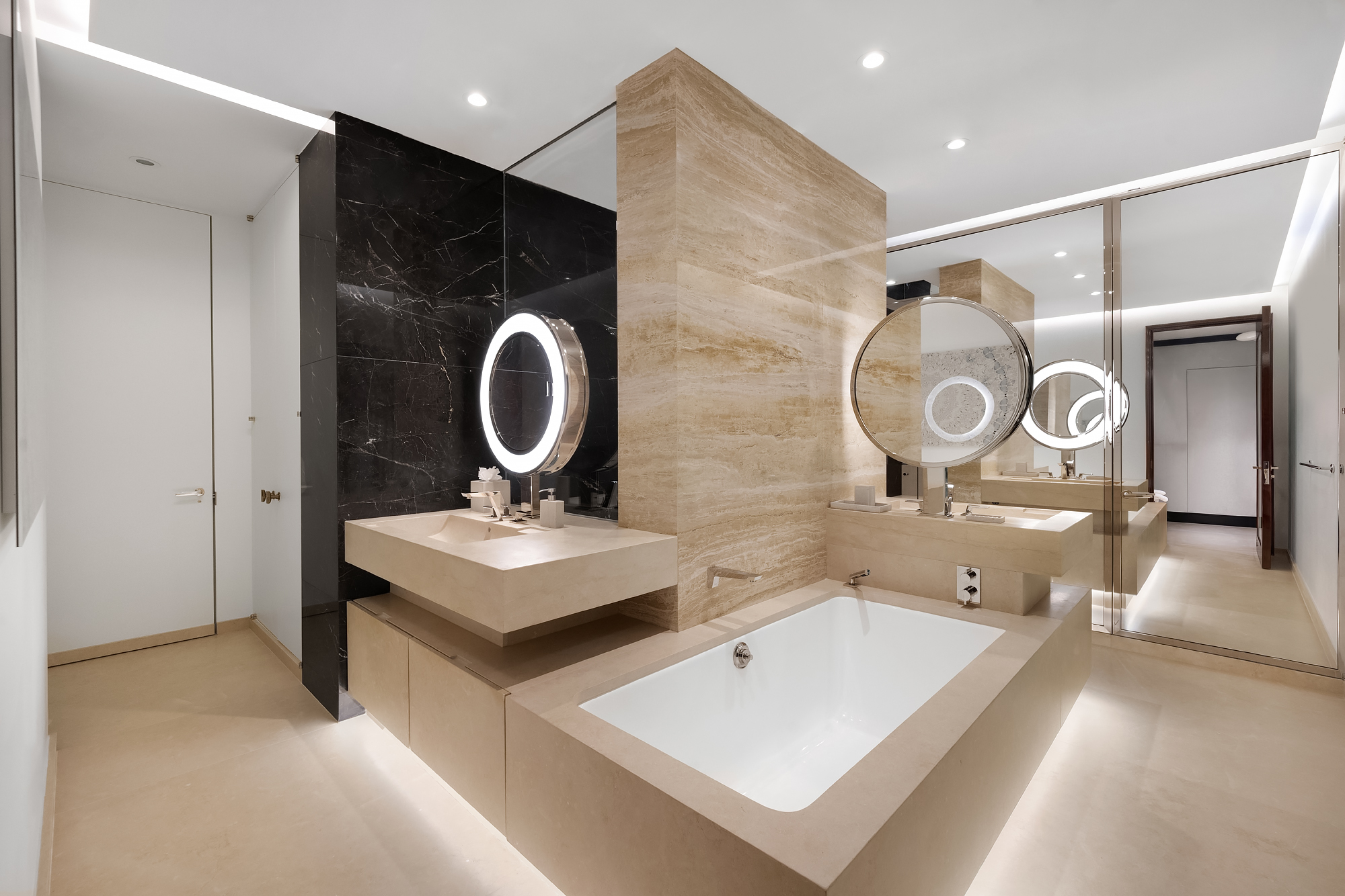 53 West 53rd Street, Unit 23D Manhattan, NY 10019 - Photo 8 of 11 a picture of a bathroom with a tub sink and mirror