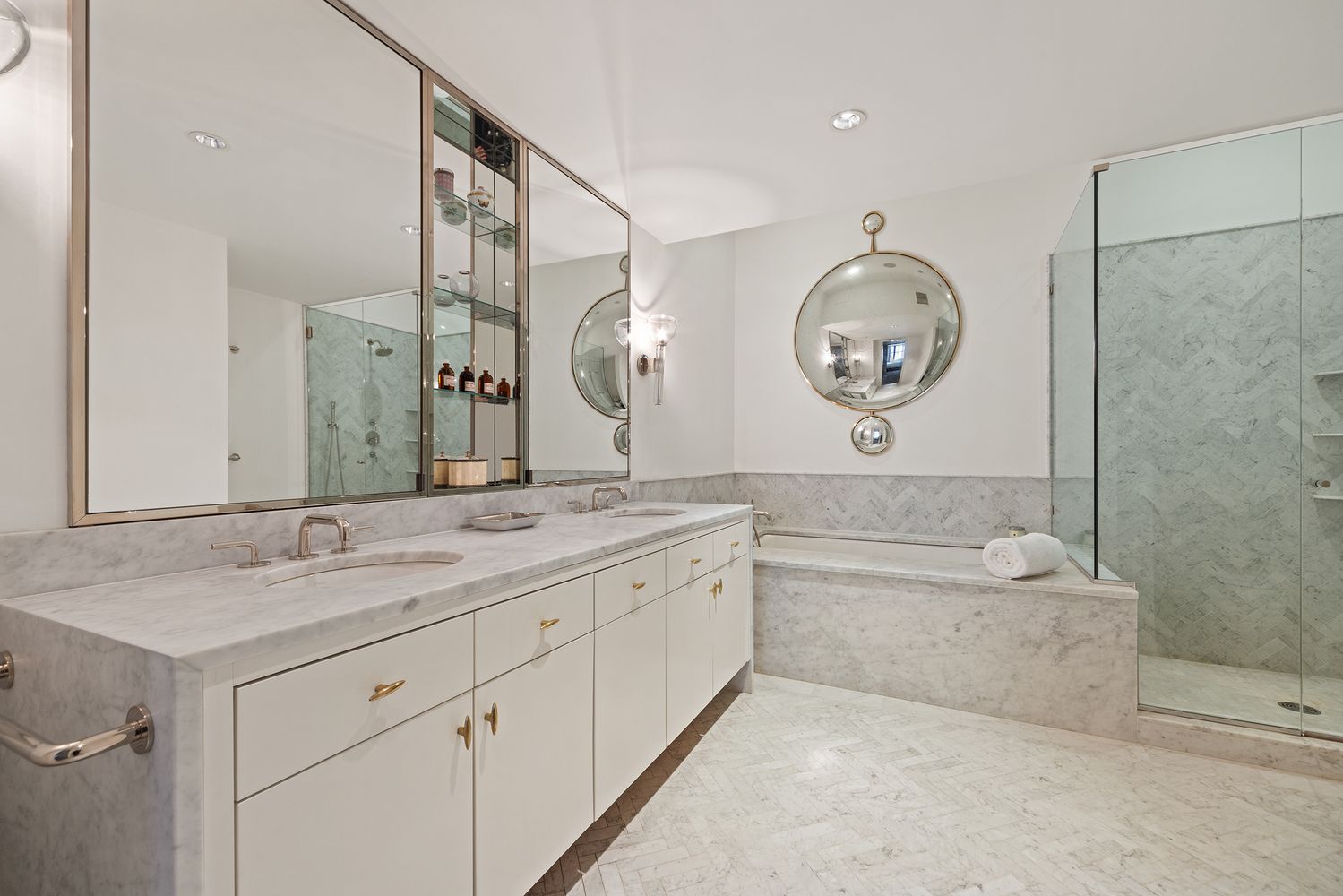 a bathroom with a granite countertop sink mirror toilet and a bathtub