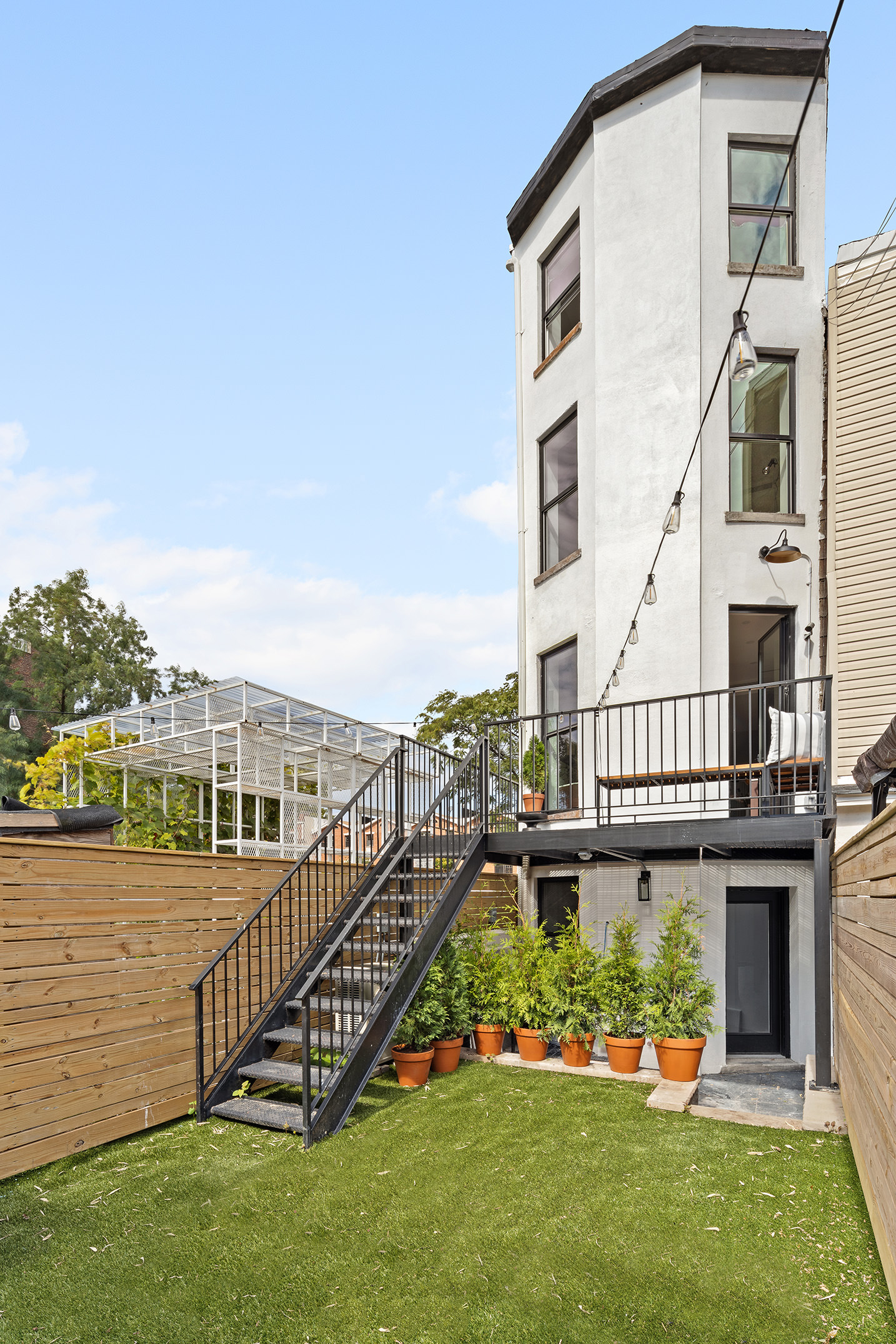 114 A Hart Street Brooklyn, NY 11206 - Photo 22 of 24 a view of a house with a yard and sitting area