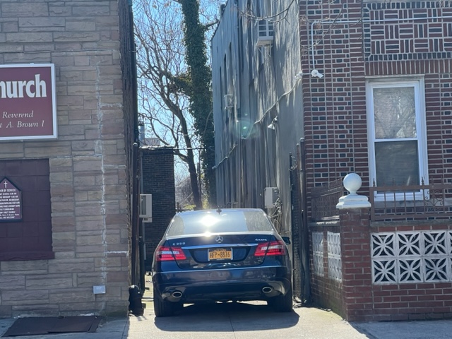 1158 Lenox Road Brooklyn, NY 11212 - Photo 3 of 4 a car parked in front of a brick building