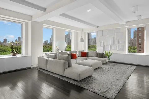 a living room with furniture and windows