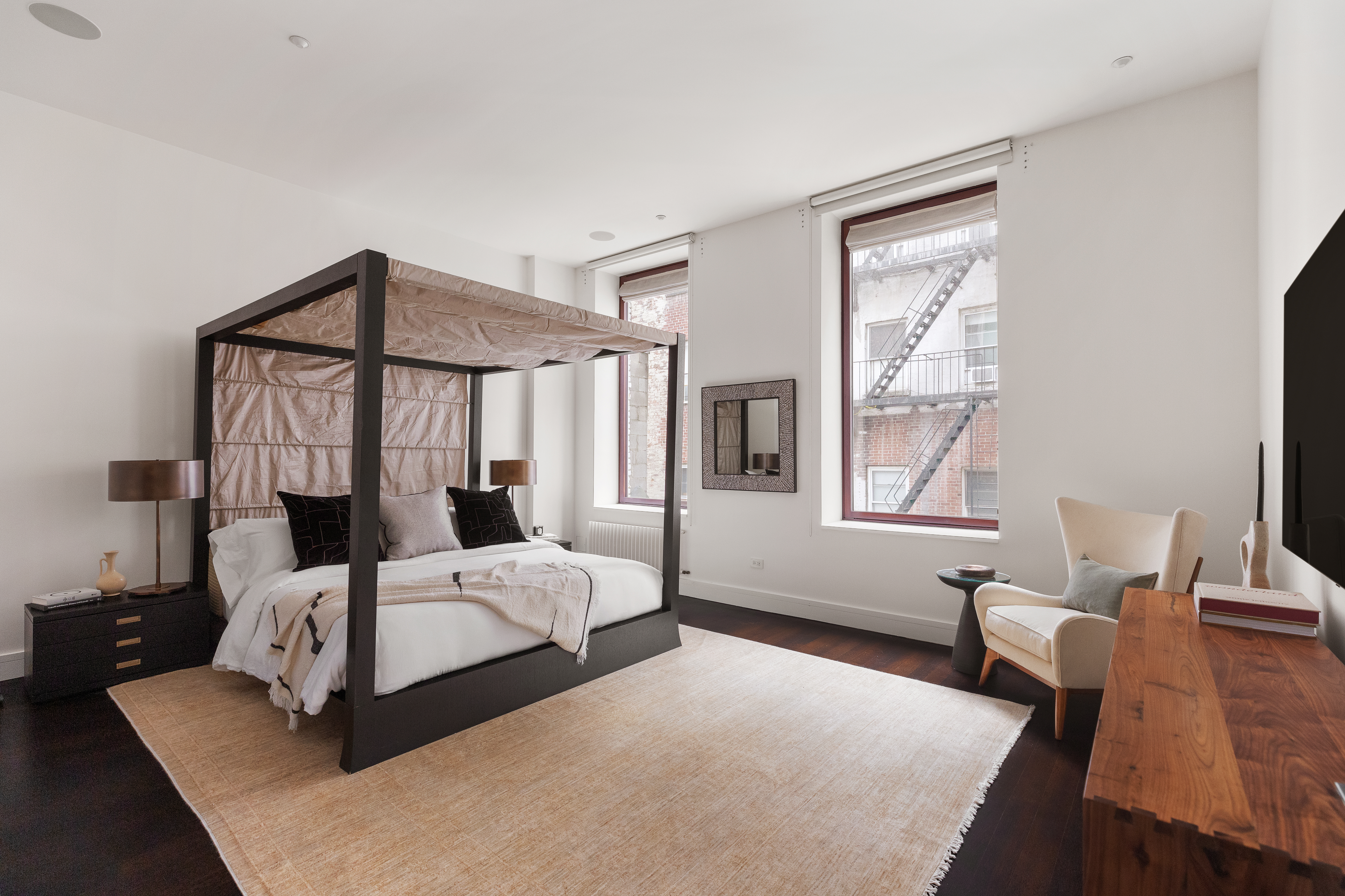 388 West Broadway, Unit 2 Manhattan, NY 10012 - Photo 12 of 27 a bedroom with two beds and a window