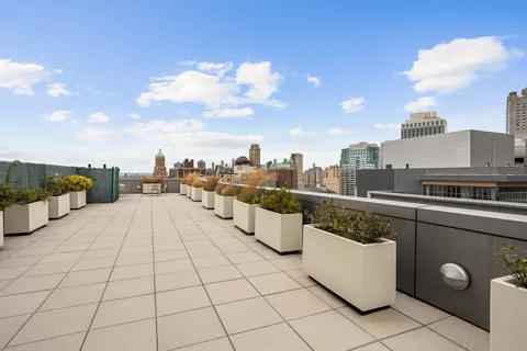a terrace with a table and chairs