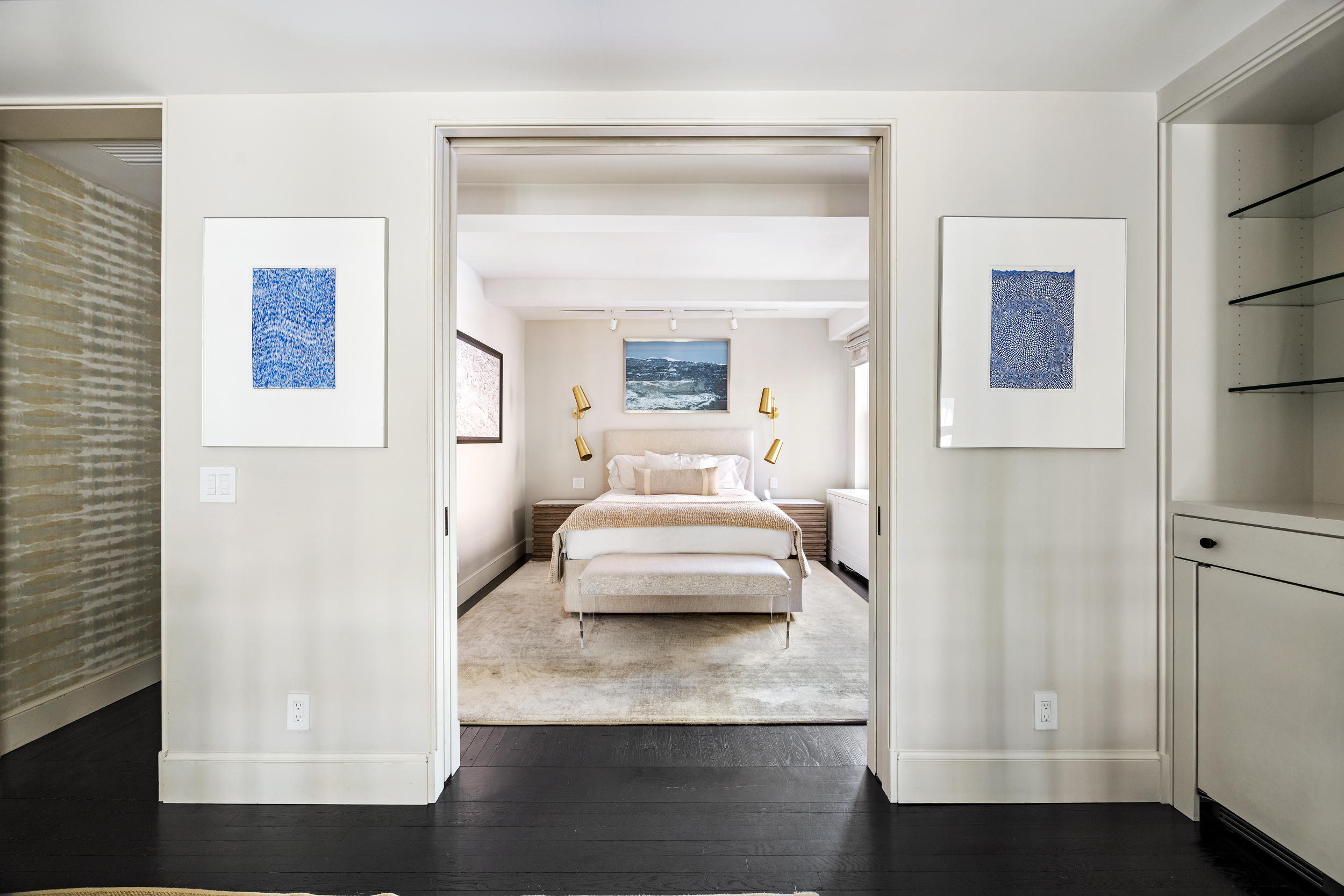 169 East 78th Street, Unit 7C Manhattan, NY 10075 - Photo 18 of 30 a bedroom with a bed and a night stand