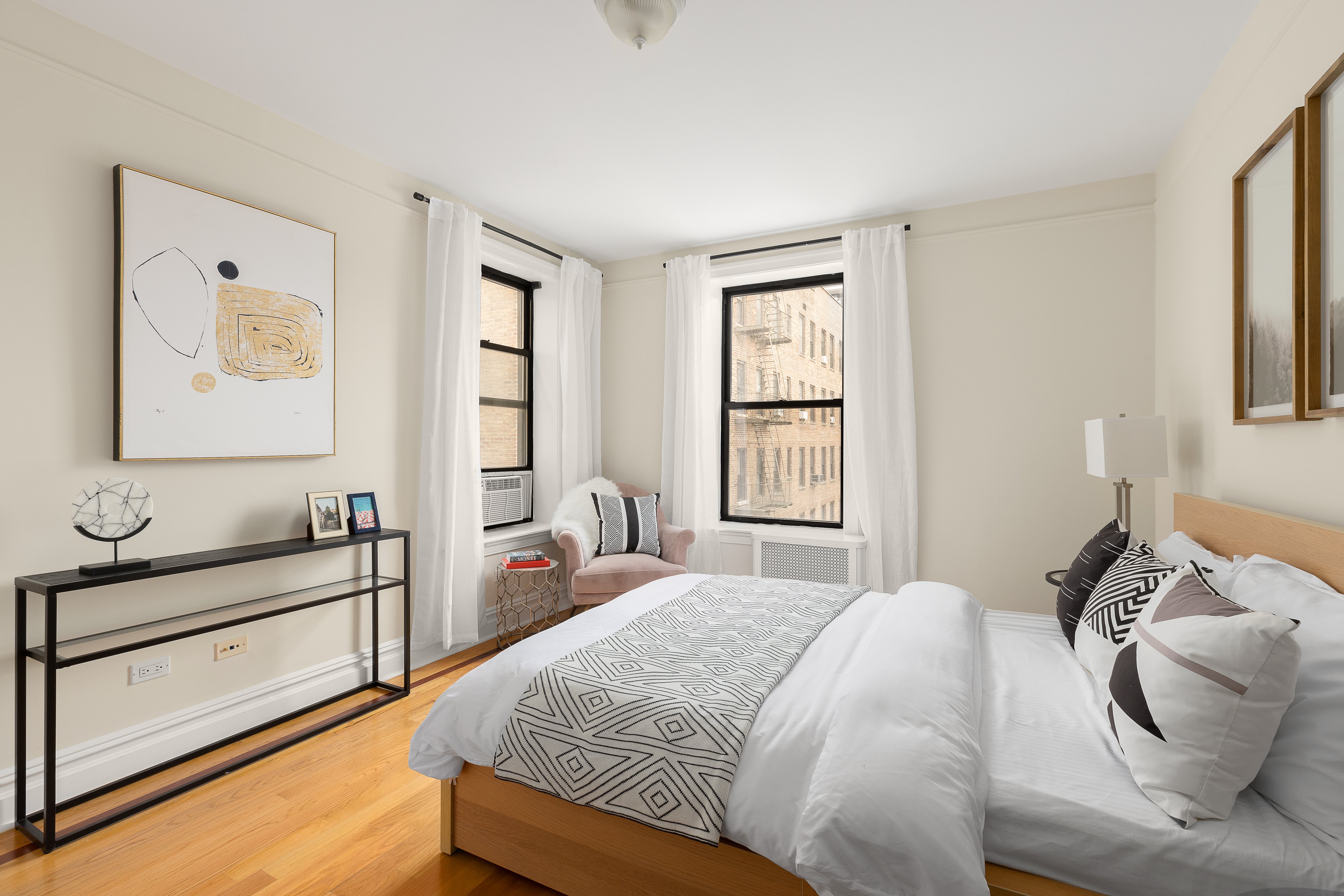 801 Riverside Drive, Unit 4B Manhattan, NY 10032 - Photo 6 of 8 a bedroom with a bed and wooden floor