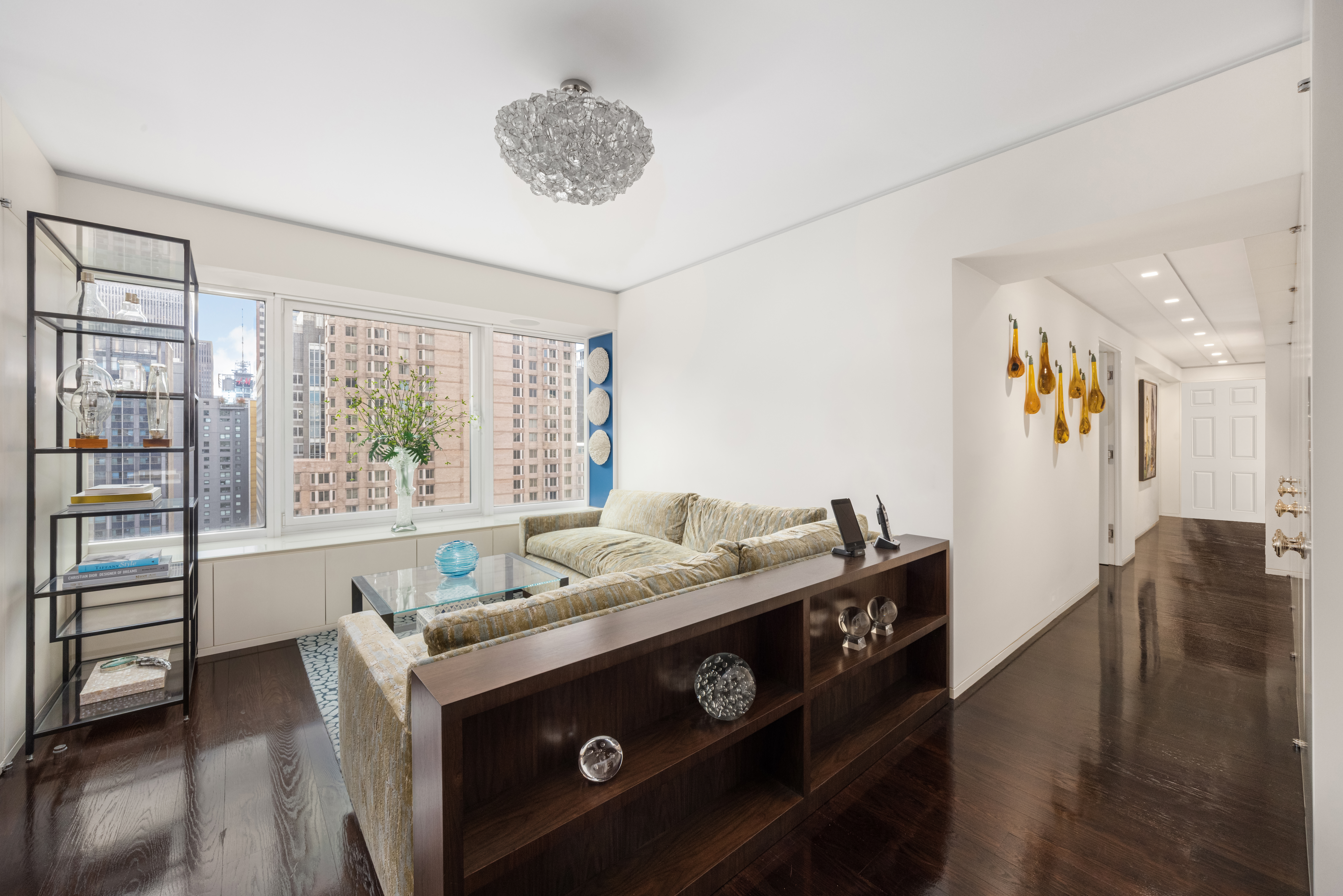 150 West 56th Street, Unit 3901 Manhattan, NY 10019 - Photo 12 of 25 a kitchen with a stove a sink and a refrigerator