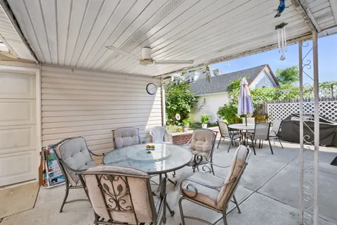 a outdoor dining space with furniture and outdoor view