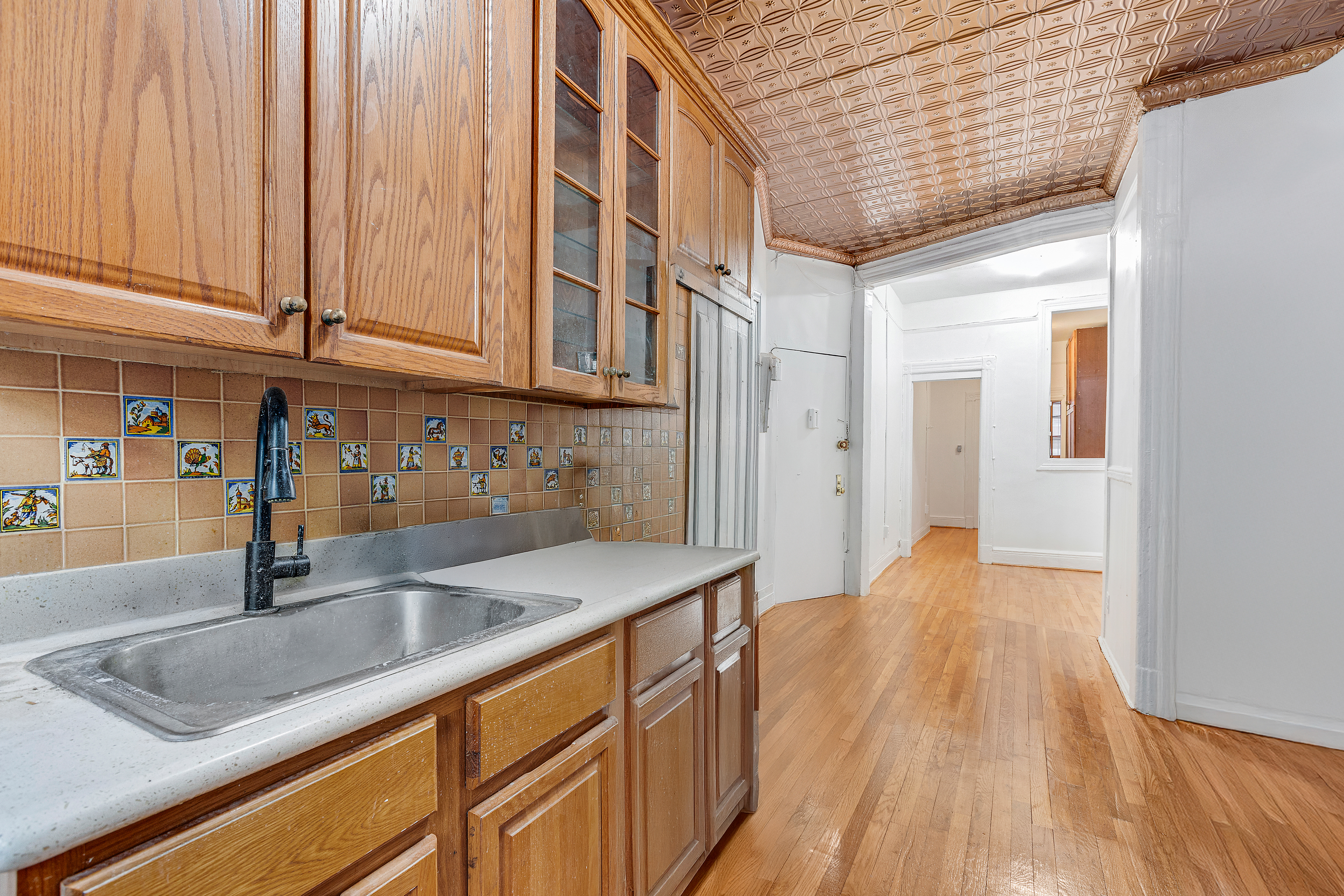 639 President Street, Unit 1L Brooklyn, NY 11215 - Photo 2 of 12 a kitchen with stainless steel appliances granite countertop a sink and dishwasher wooden cabinets with a granite countertops
