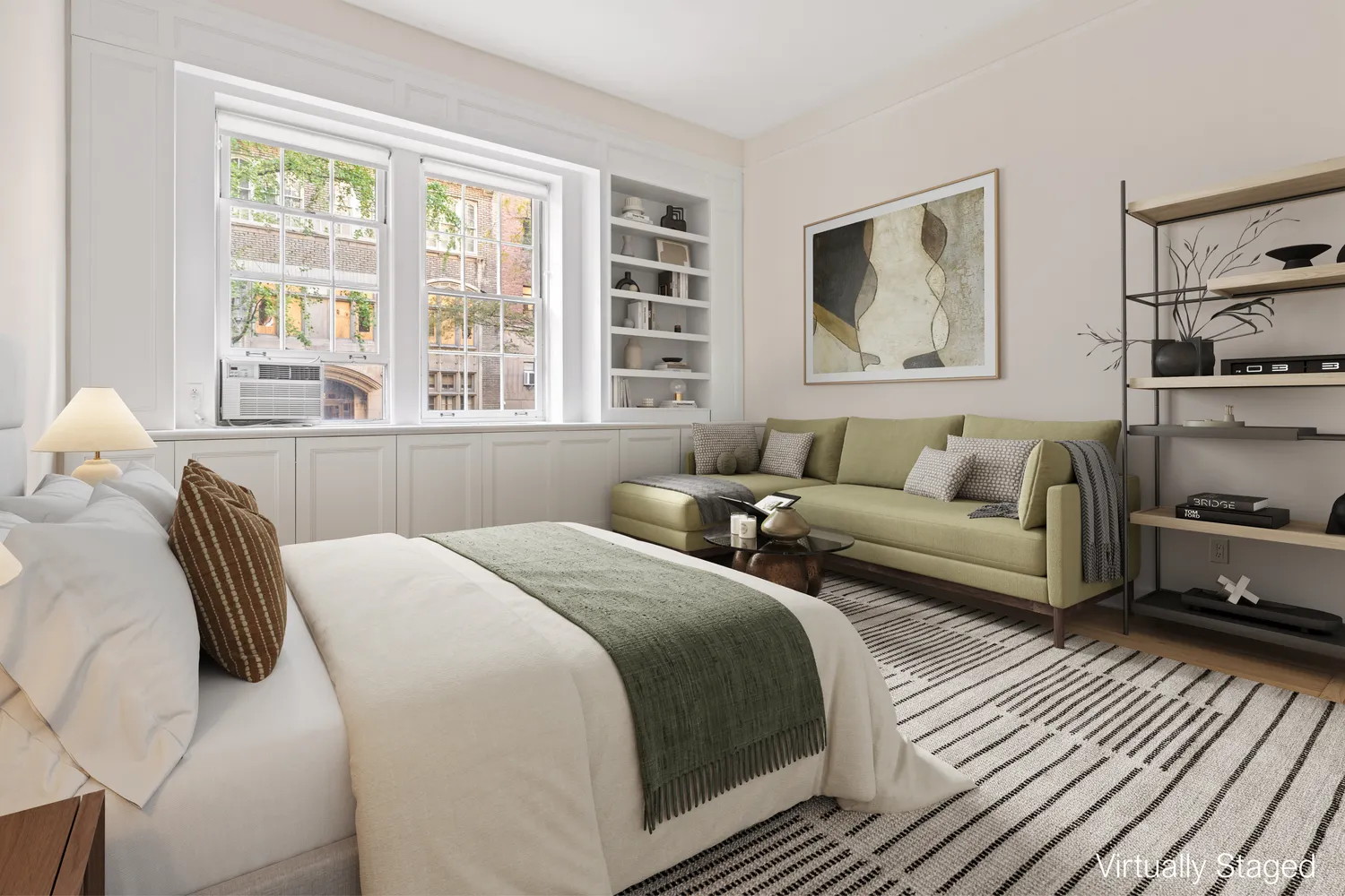 a bedroom with a bed couch and a window