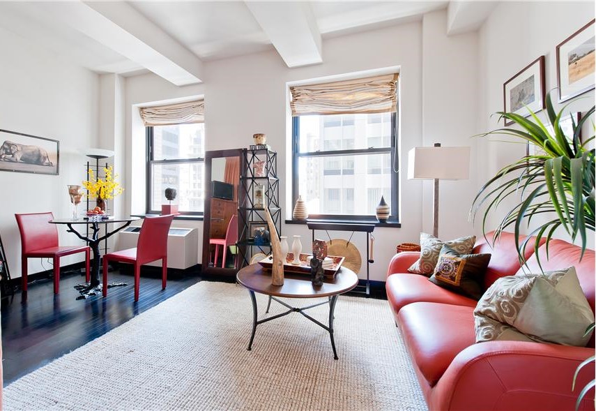 a living room with furniture and a window
