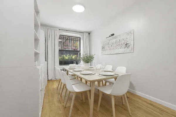 a view of a dining room with furniture and window