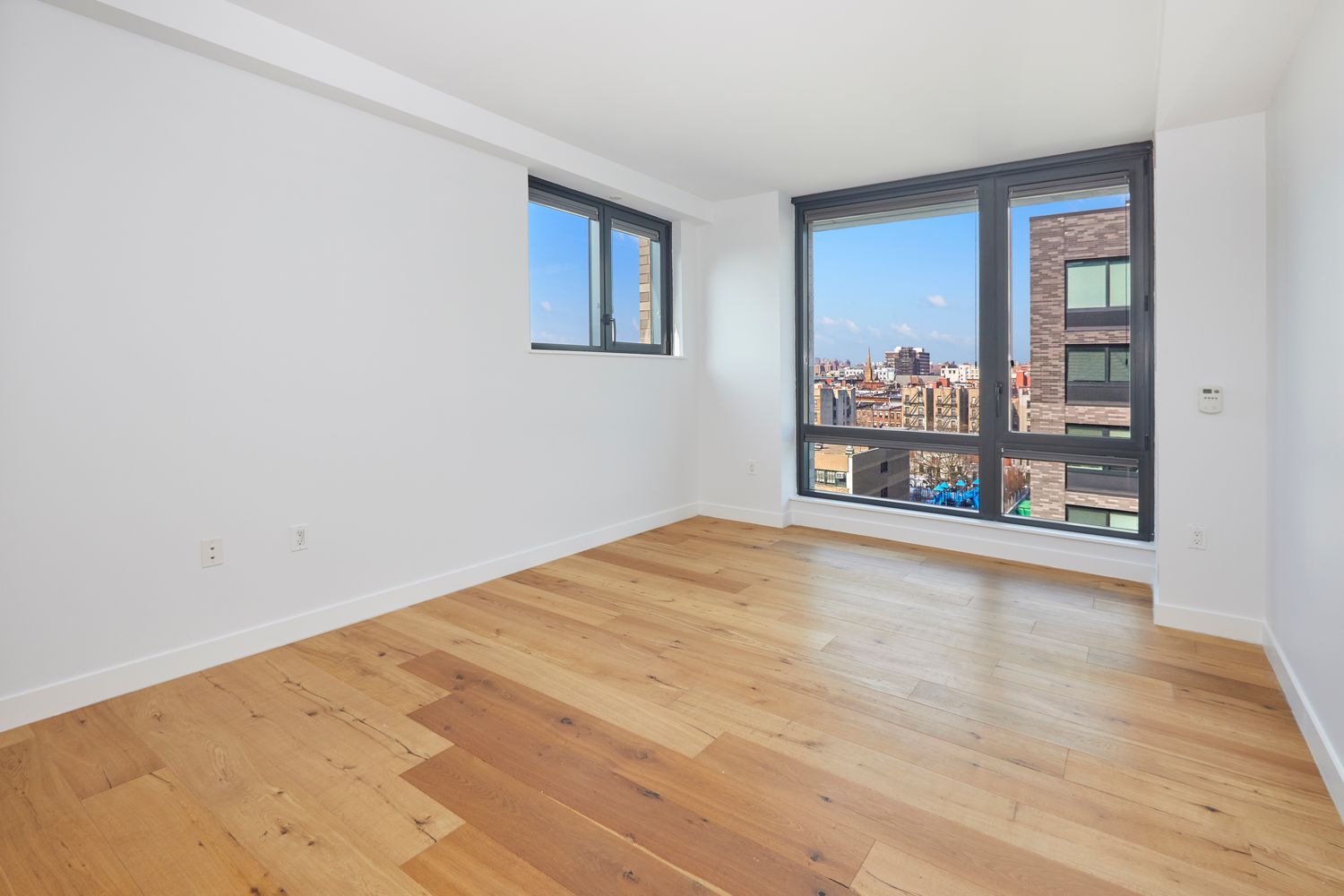 23 West 116th Street, Unit 8A Manhattan, NY 10026 - Photo 9 of 28 a view of an empty room with a window
