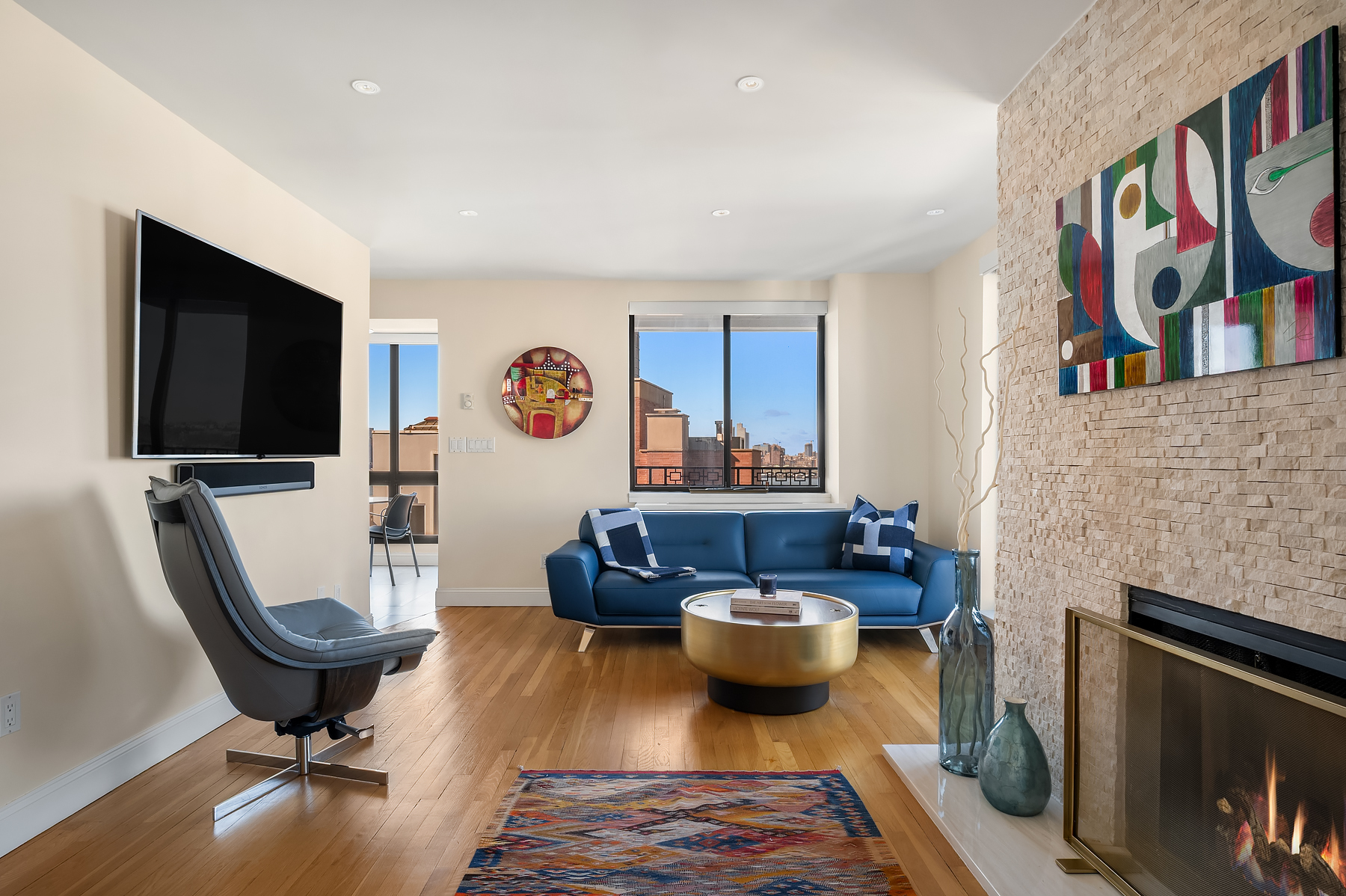 366 West 11th Street, Unit PHF Manhattan, NY 10014 - Photo 3 of 28 a living room with furniture and a flat screen tv