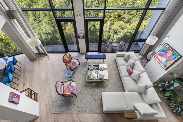 a living room with furniture and garden view