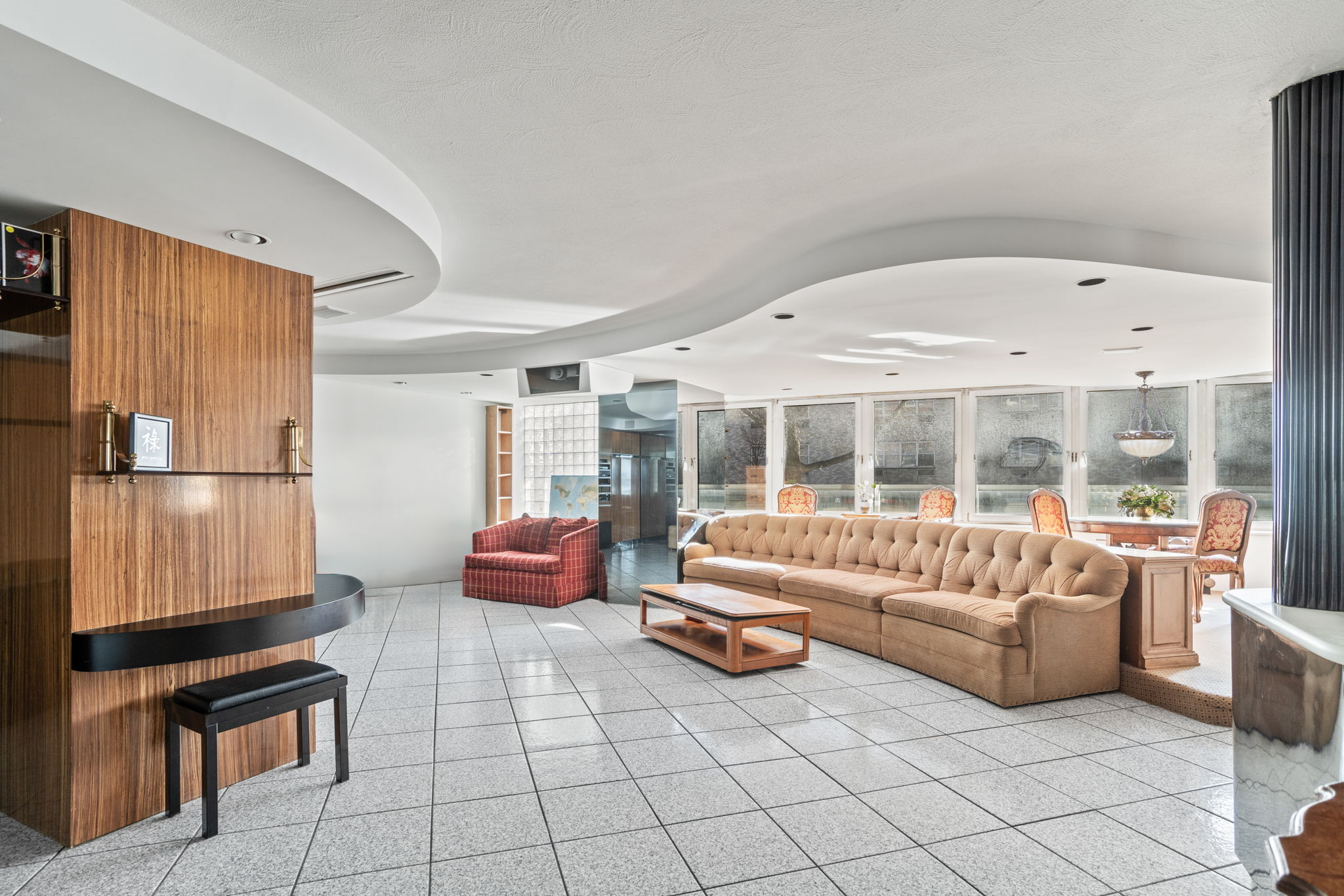 363 East 76th Street, Unit 2F Manhattan, NY 10075 - Photo 3 of 21 a living room with furniture and a large window