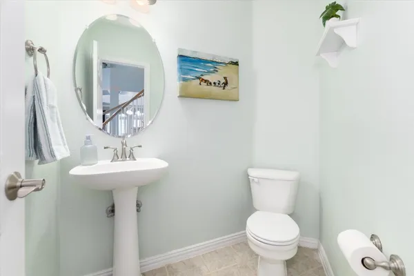 a bedroom with furniture and a large window