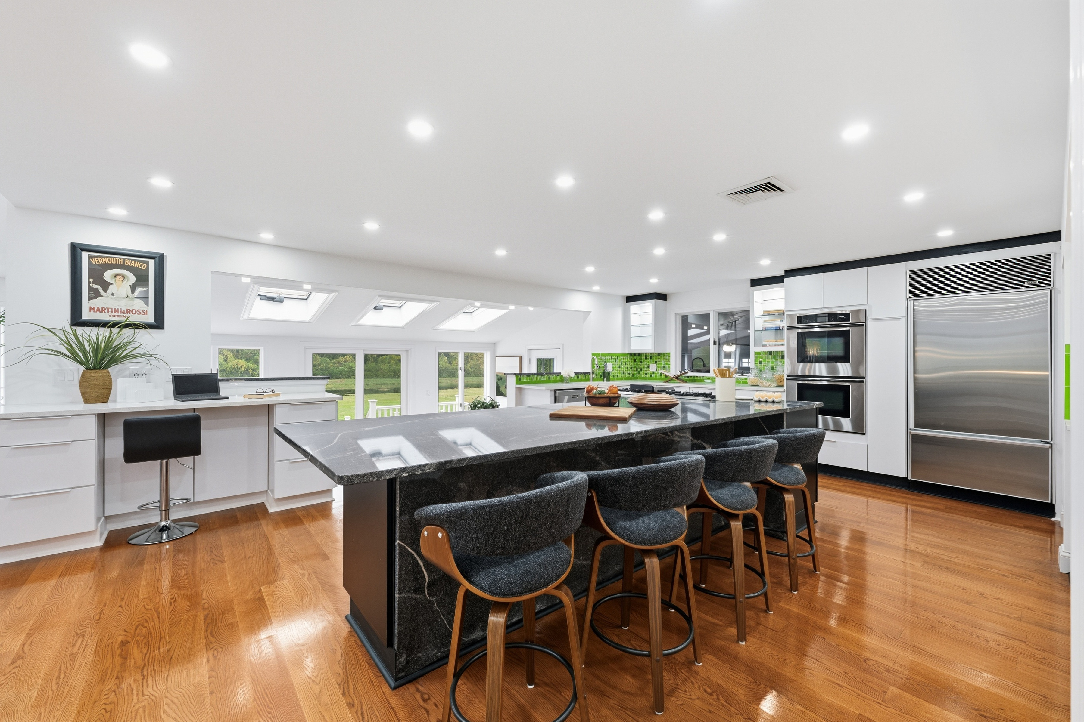 6 Lynbrook Road Southborough, MA 01772 - Photo 5 of 84 a kitchen with stainless steel appliances kitchen island granite countertop a table and chairs in it