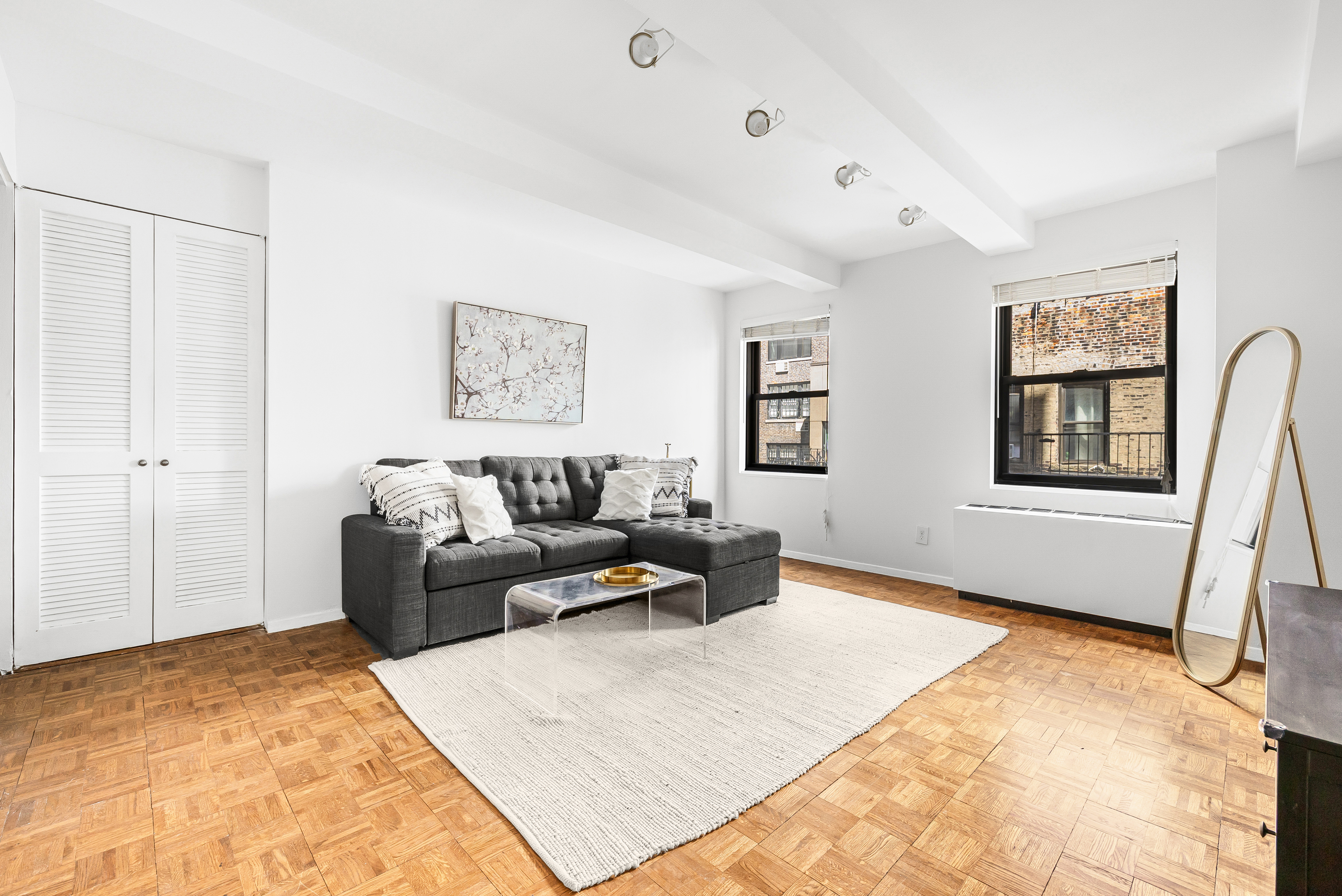 a living room with furniture and a rug