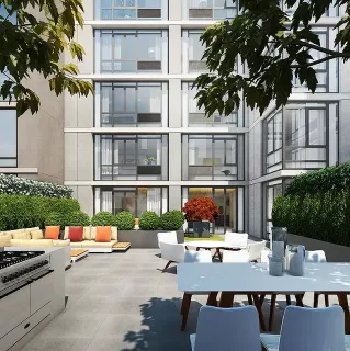 a view of a patio with couches table and chairs and potted plants