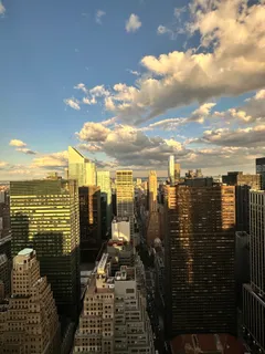 a bedroom with a bed and glass window