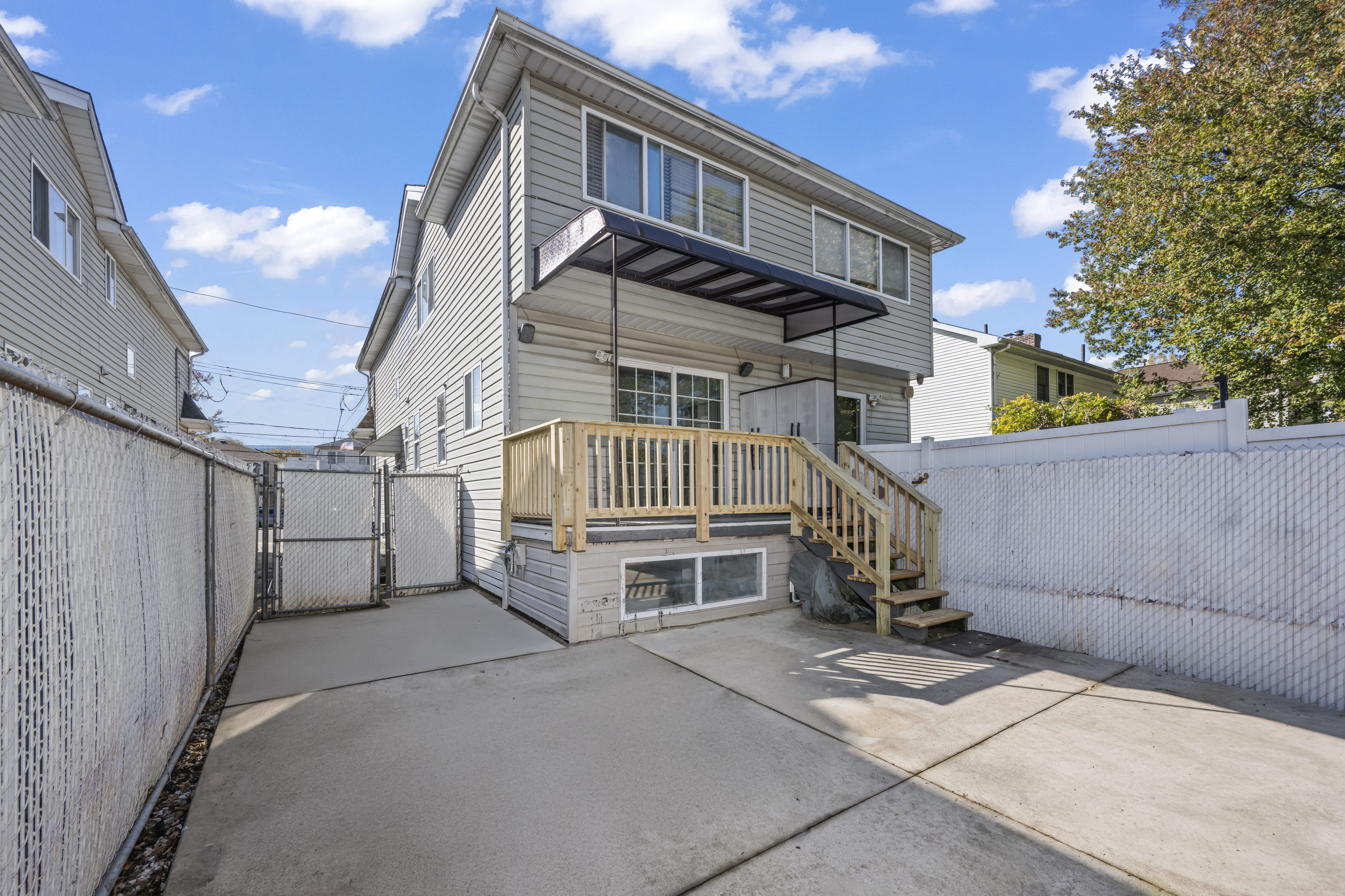 55 Sideview Avenue Staten Island, NY 10314 - Photo 22 of 28 a view of a house with a large window and stairs
