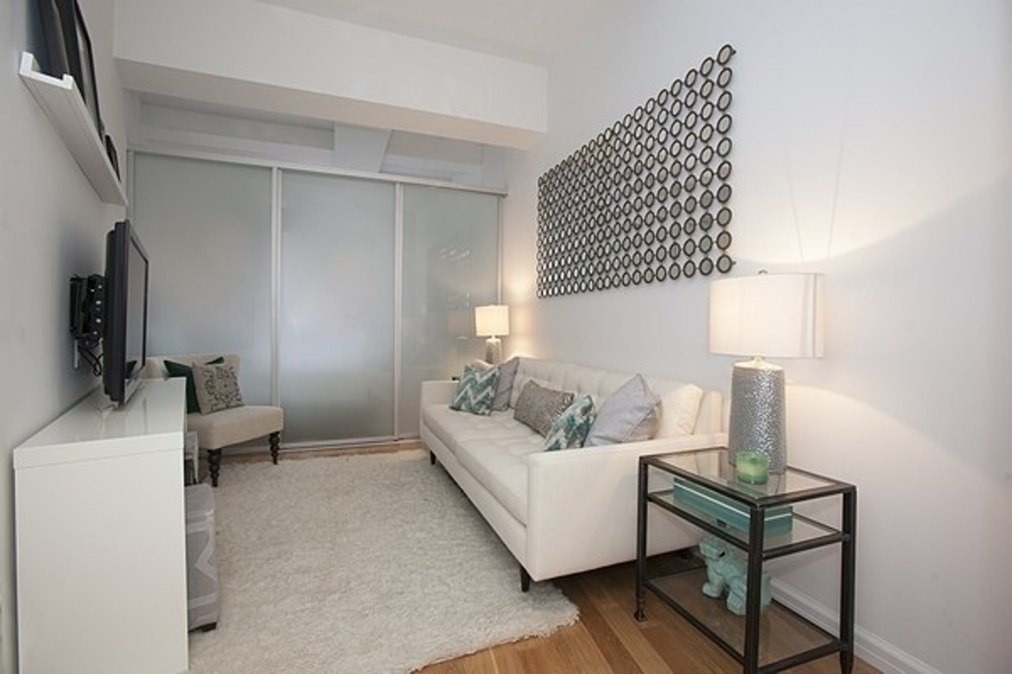 99 John Street, Unit 926 Manhattan, NY 10038 - Photo 3 of 12 a living room with furniture