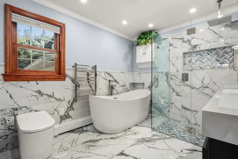 a bathroom with a bathtub and sink