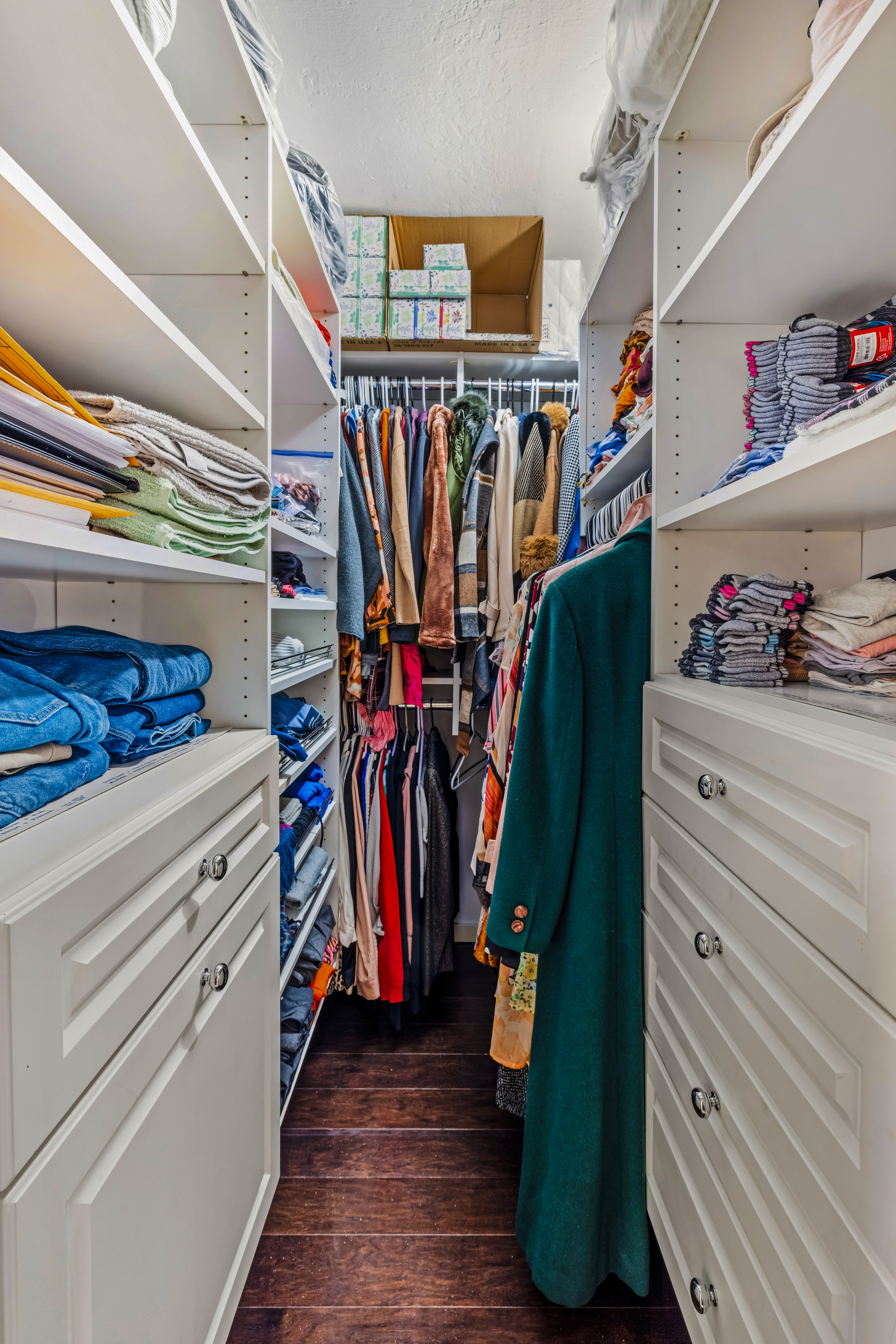 139 East 33rd Street, Unit 3M Manhattan, NY 10016 - Photo 8 of 11 a view of walk in closet with clothes and shoes
