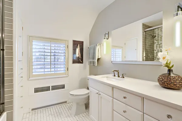 a bathroom with a sink a toilet and a bathtub