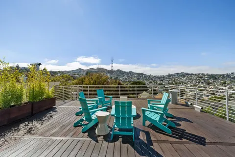 a view of a house with backyard porch and sitting area