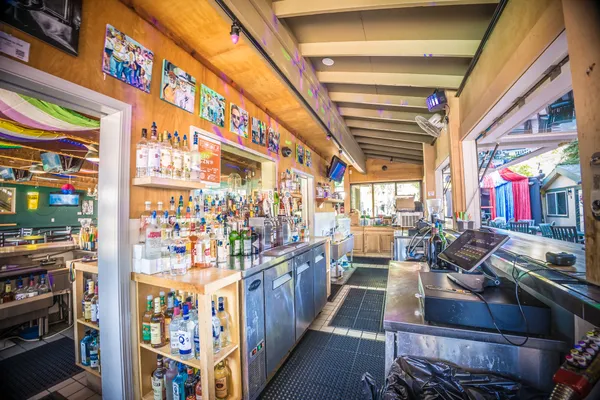 a view of a tables and chairs under an umbrella