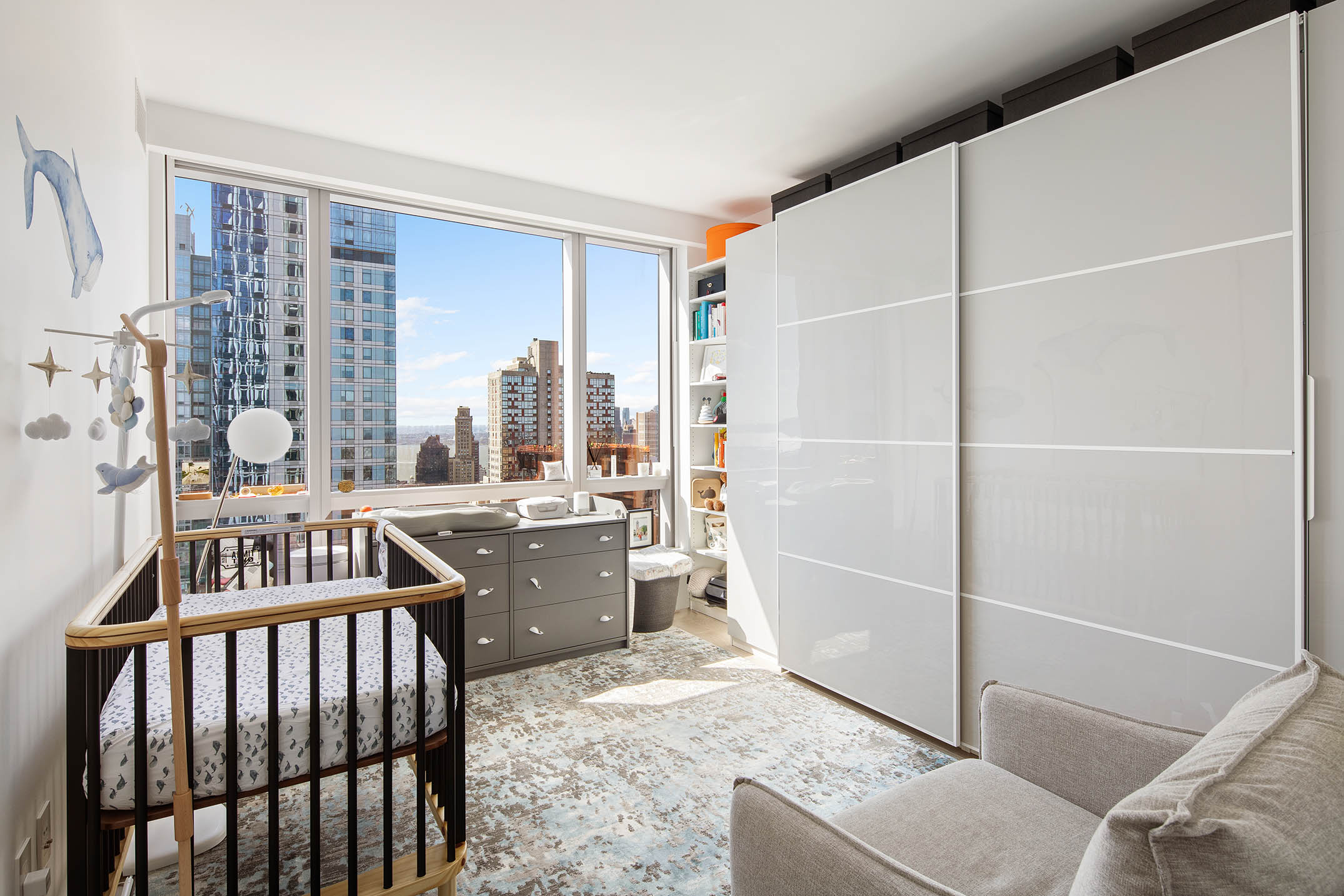 1 City Point, Unit 43H Brooklyn, NY 11201 - Photo 7 of 19 a living room with a couch and a table