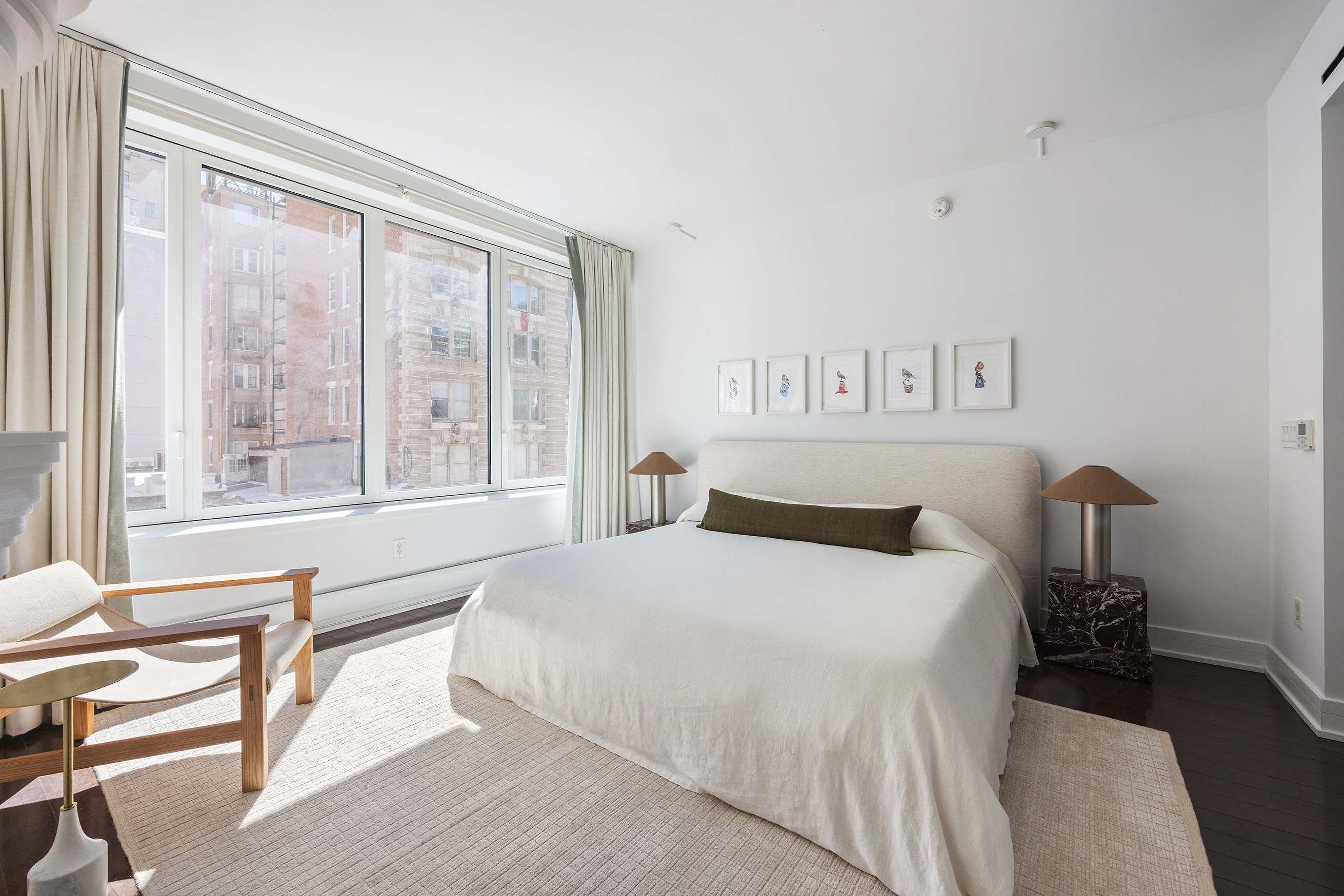 5 Franklin Place, Unit 9D Manhattan, NY 10013 - Photo 8 of 20 a bedroom with a bed and a large window