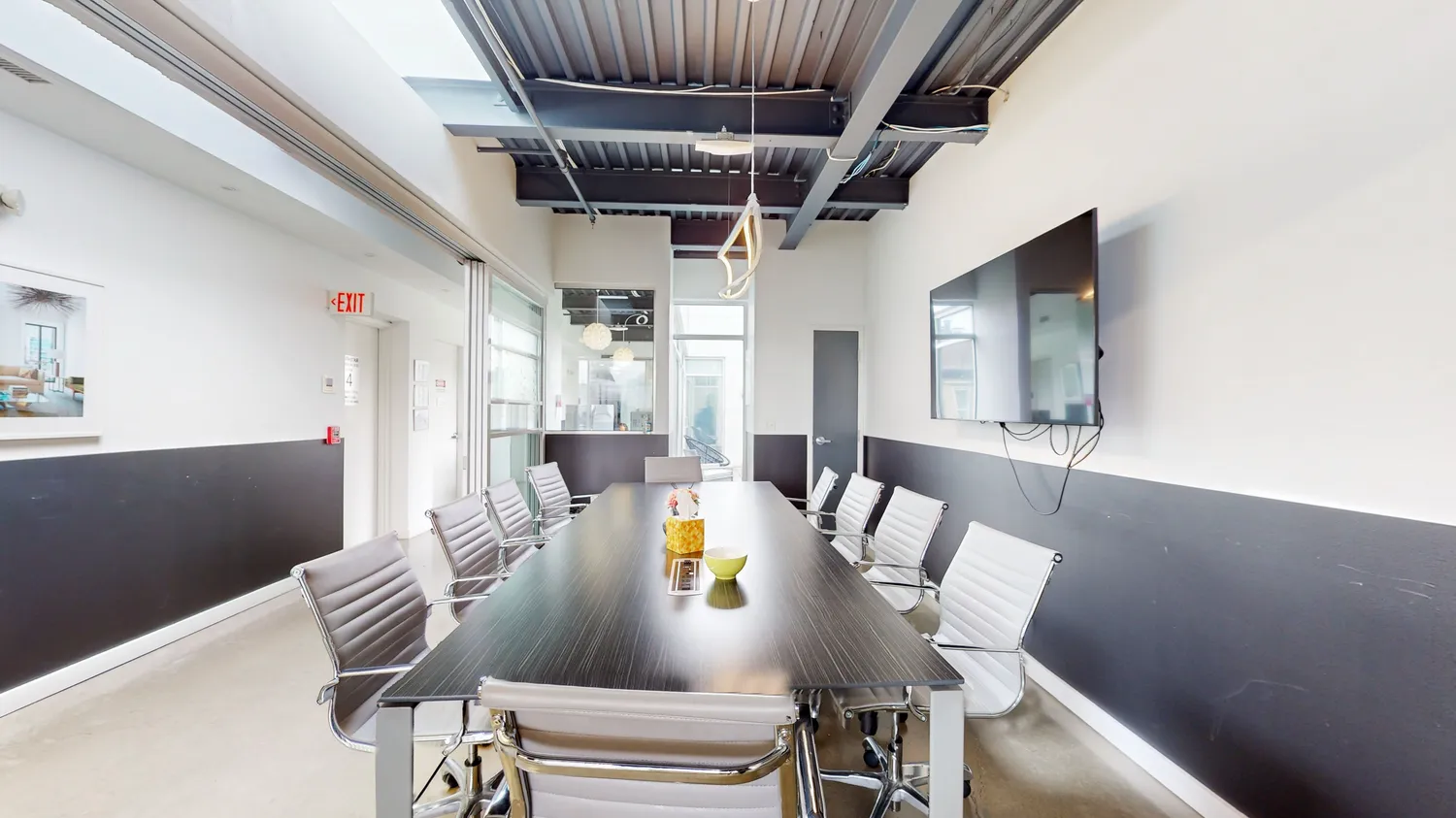 a dining room with furniture a rug and wooden floor