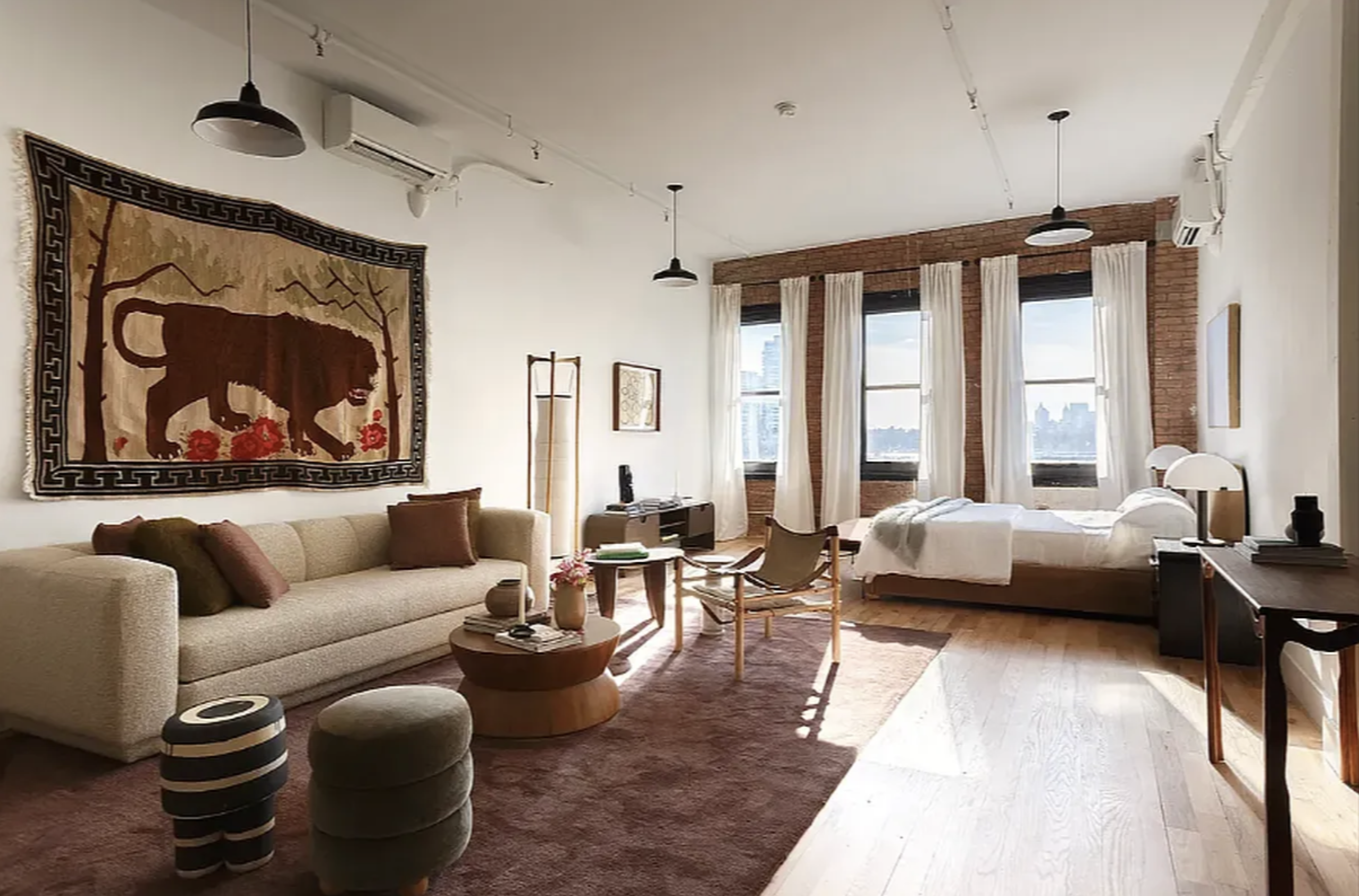239 Banker Street Brooklyn, NY 11222 - Photo 2 of 11 a living room with furniture ceiling fan and a rug