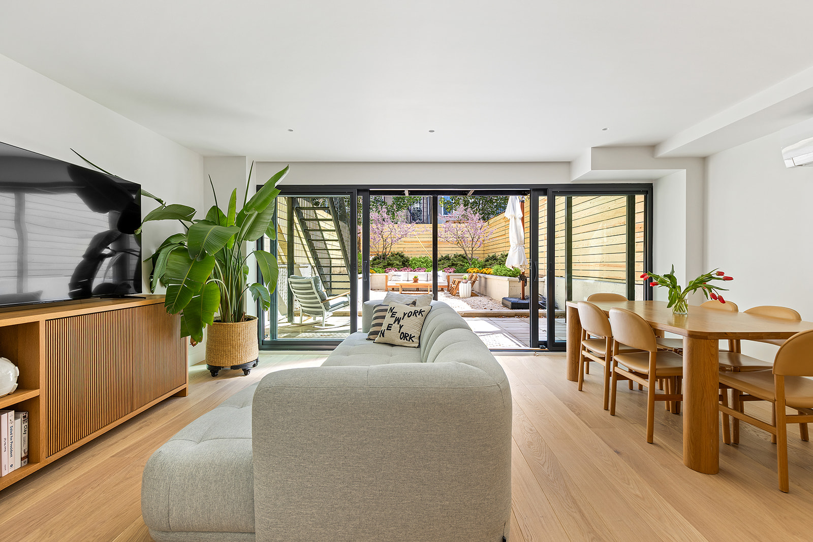 59 Cheever Place Brooklyn, NY 11231 - Photo 19 of 25 a living room with furniture floor to ceiling window and potted plants