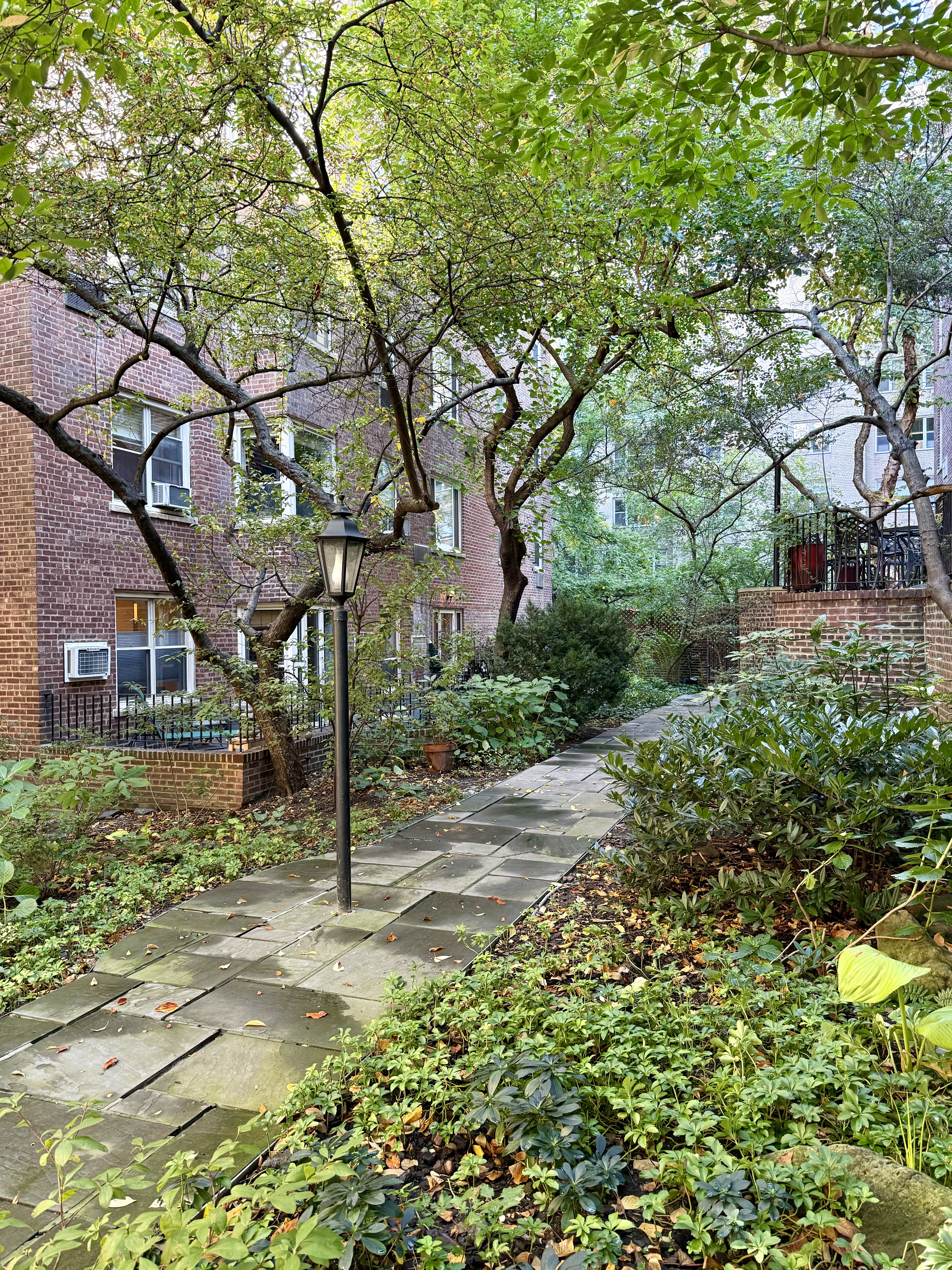 525 East 89th Street, Unit 2L Manhattan, NY 10128 - Photo 11 of 13 a view of a house with a tree