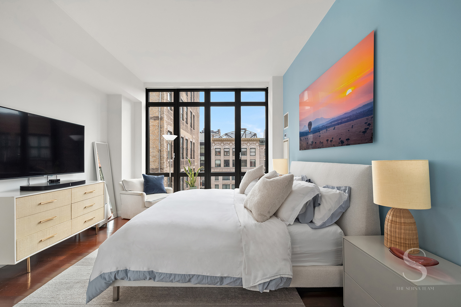 4 West 21st Street, Unit 14A Manhattan, NY 10010 - Photo 7 of 16 a bedroom with a bed and a flat screen tv