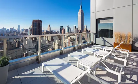a view of a terrace with sitting area