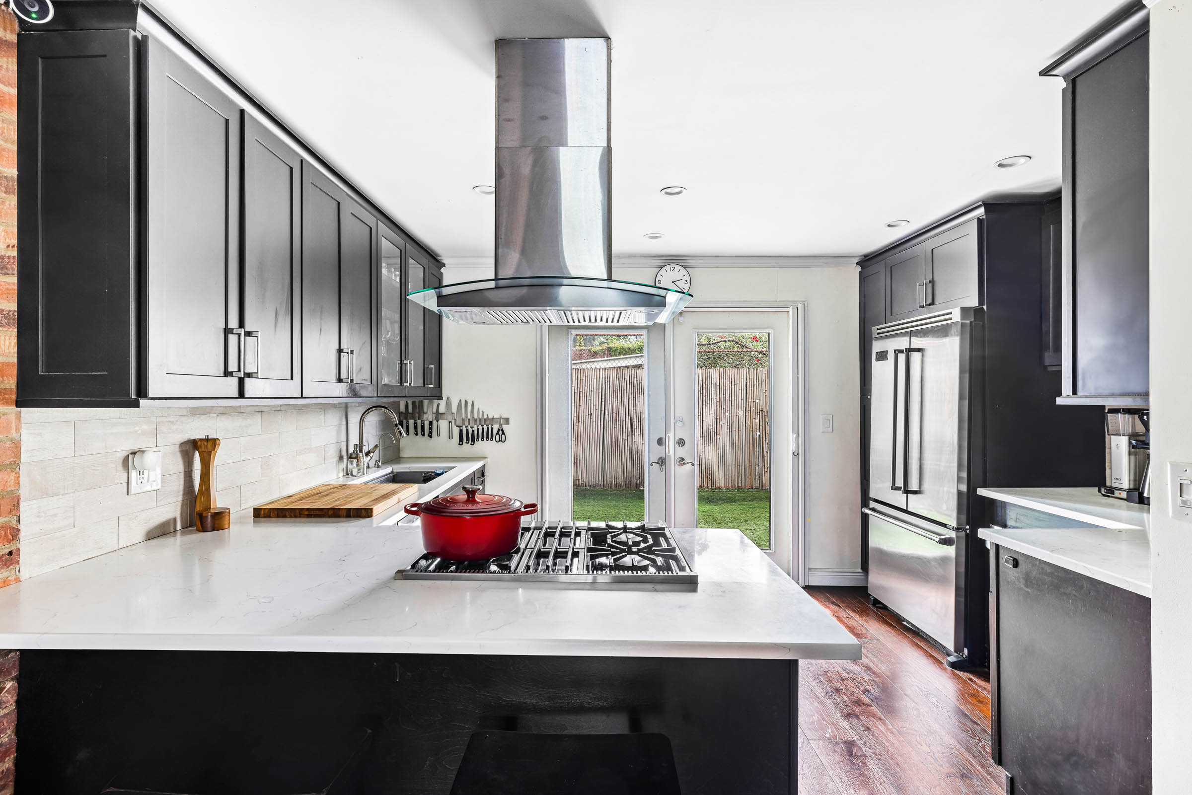 170 Skillman Avenue Brooklyn, NY 11211 - Photo 5 of 12 a kitchen with stainless steel appliances granite countertop a sink refrigerator and cabinets