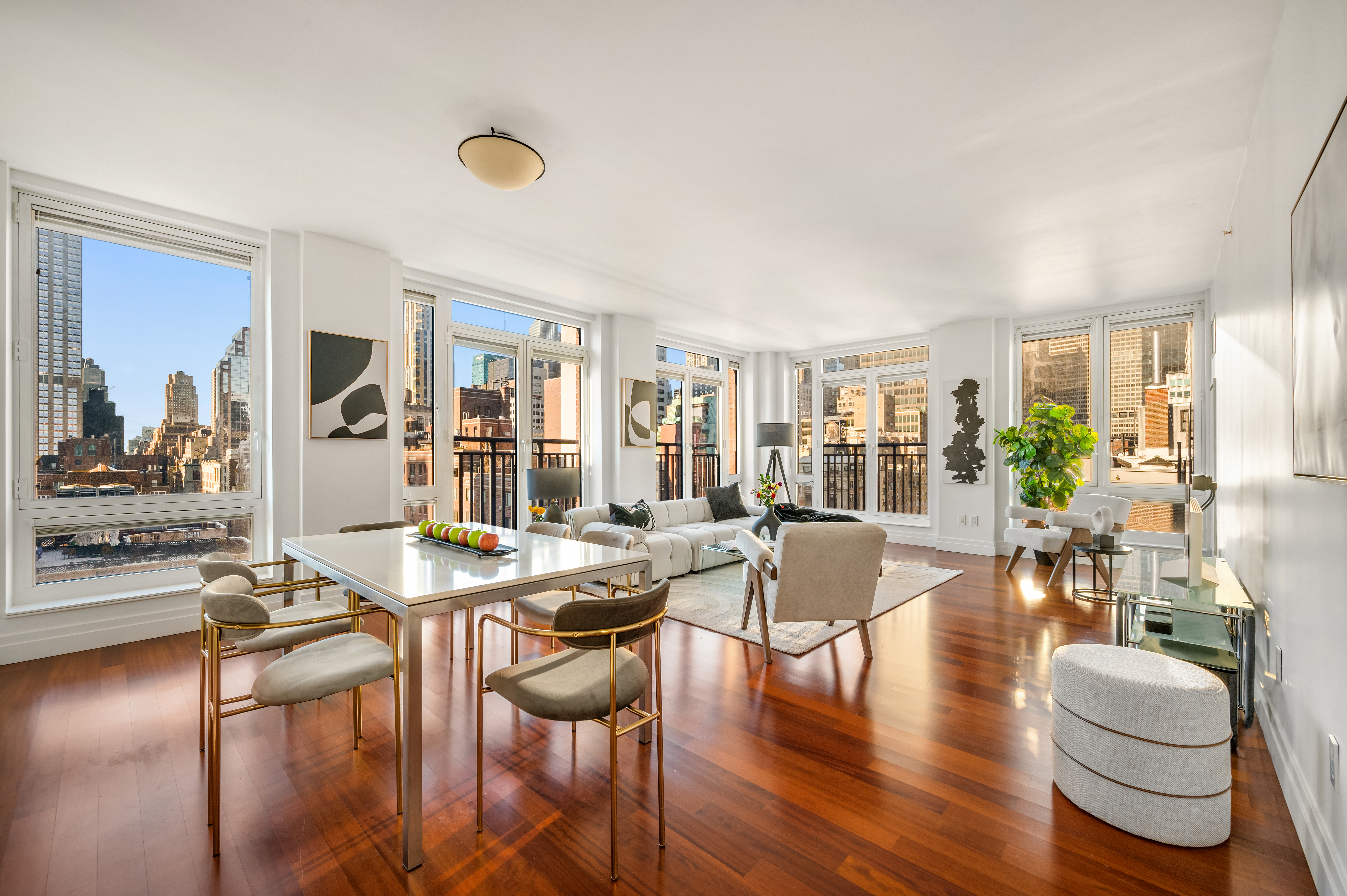 45 Park Avenue, Unit 1801 Manhattan, NY 10016 - Photo 1 of 12 a view of a dining room with furniture and wooden floor