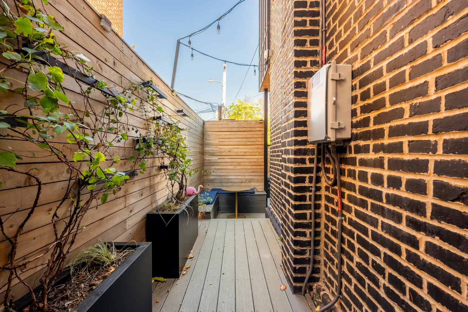 a view of a balcony with wooden floor and staircase