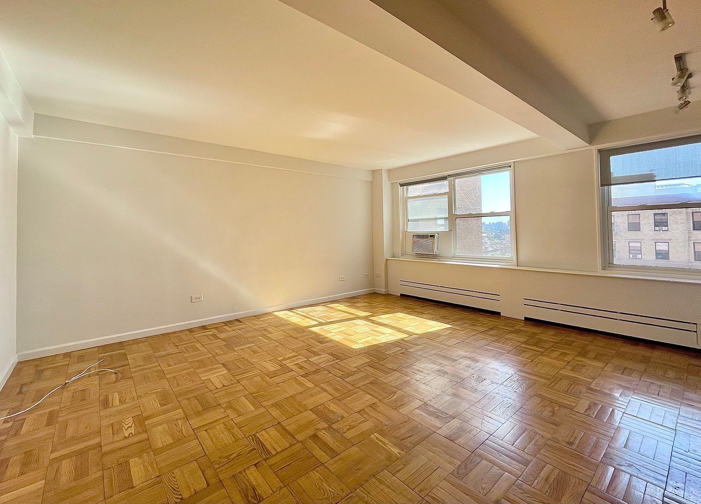 345 West 145th Street, Unit 8A1 Manhattan, NY 10031 - Photo 1 of 7 an empty room with a empty space and window