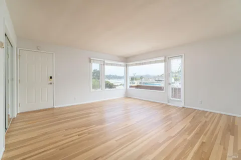 a kitchen with cabinets appliances and a window