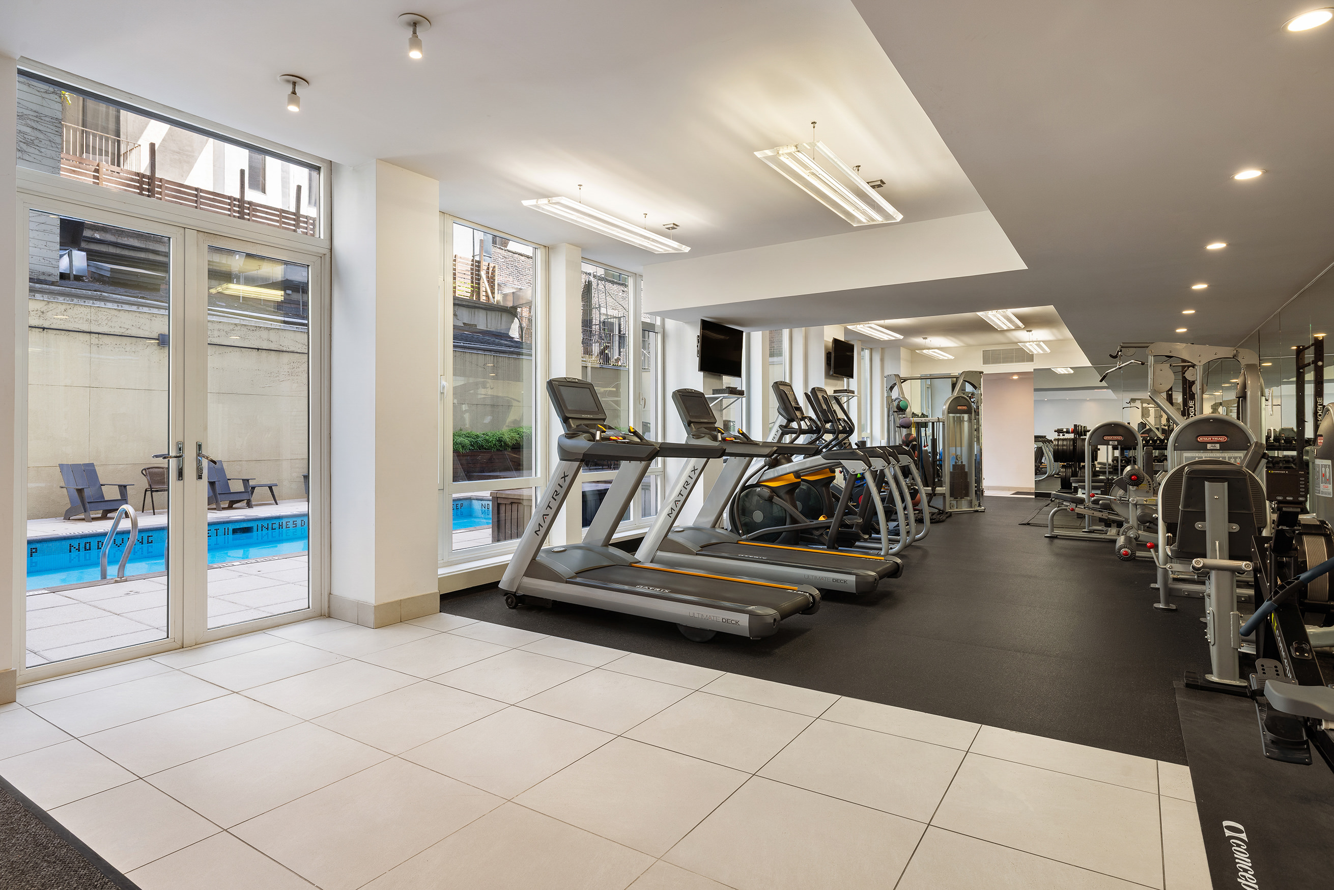 133 West 22nd Street, Unit 8C Manhattan, NY 10011 - Photo 9 of 11 a view of a room with gym equipment