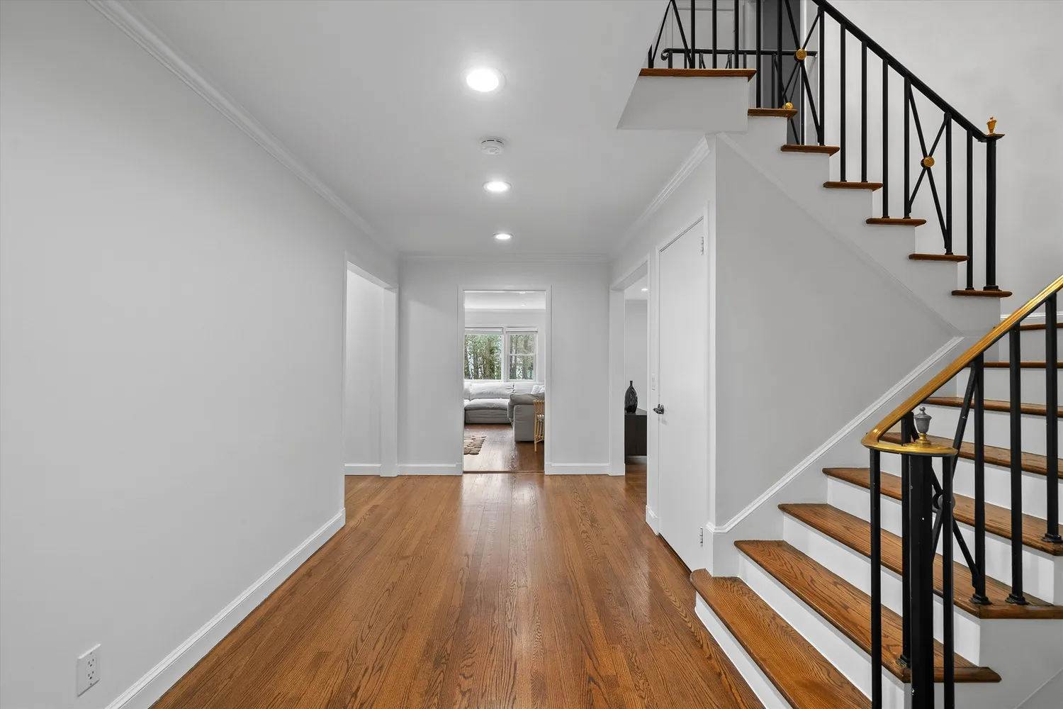 a view of entryway with wooden floor