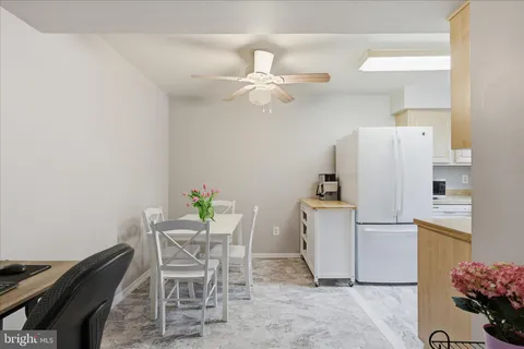 a kitchen with a sink a stove and cabinets