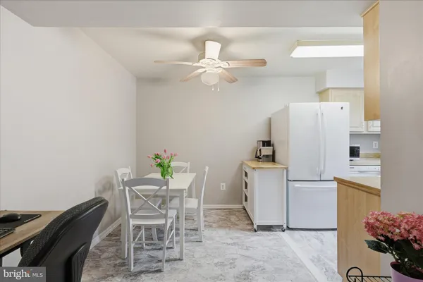 a kitchen with a sink a stove and cabinets