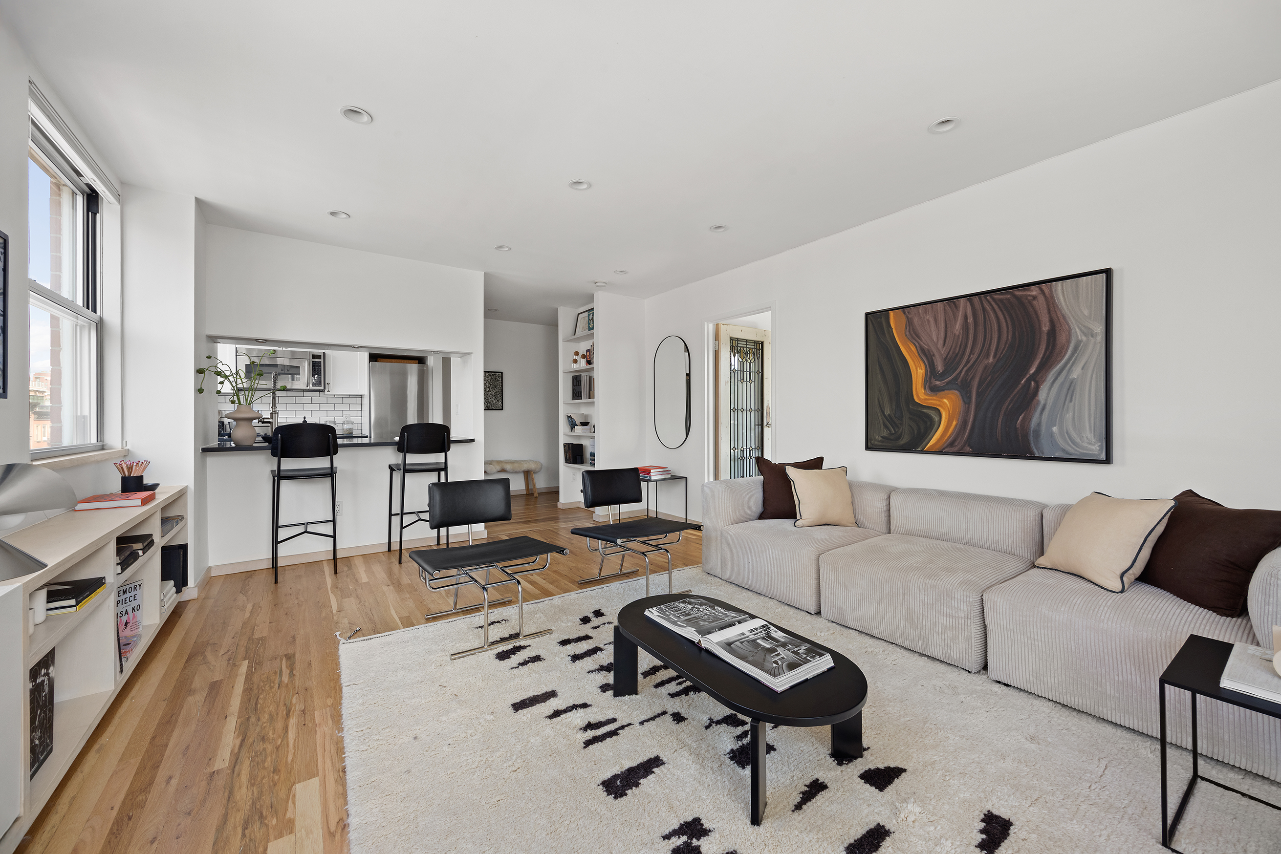 350 West 14th Street, Unit 6D Manhattan, NY 10014 - Photo 5 of 16 a living room with furniture or couch and a wooden floor