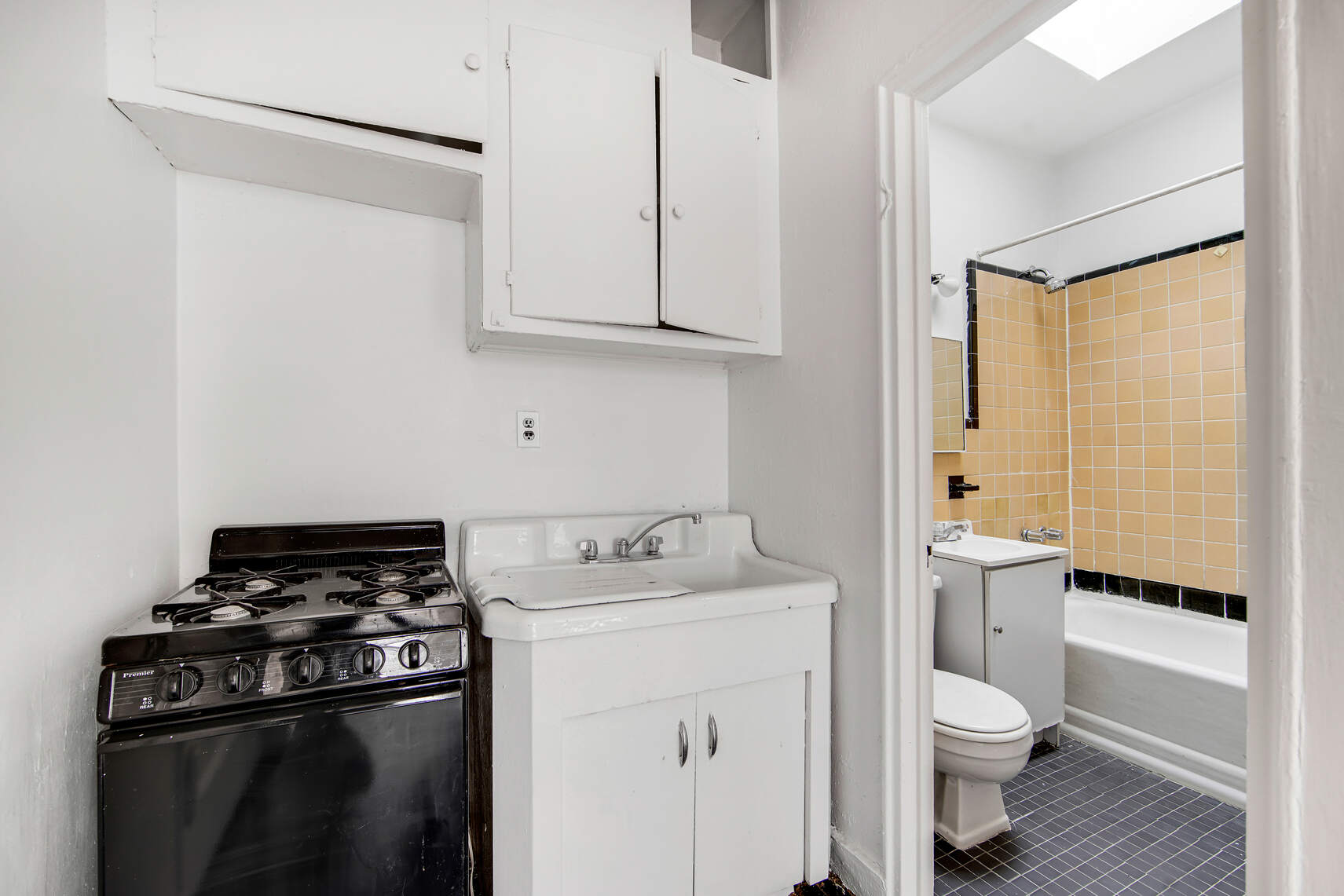337 East 18th Street Manhattan, NY 10003 - Photo 13 of 16 a bathroom with a granite countertop sink toilet and shower
